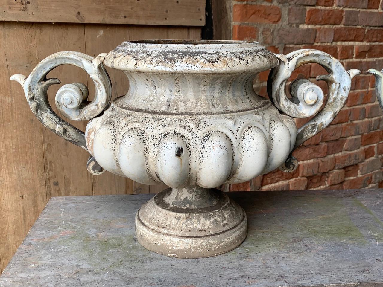 A beautiful set of 3 x 19th century enamelled iron urns by Alfred Corneau. These will make lovely decorative urns either in the garden or indoors. 
The original enamel has lovely weathering from being outside for many years giving them a great