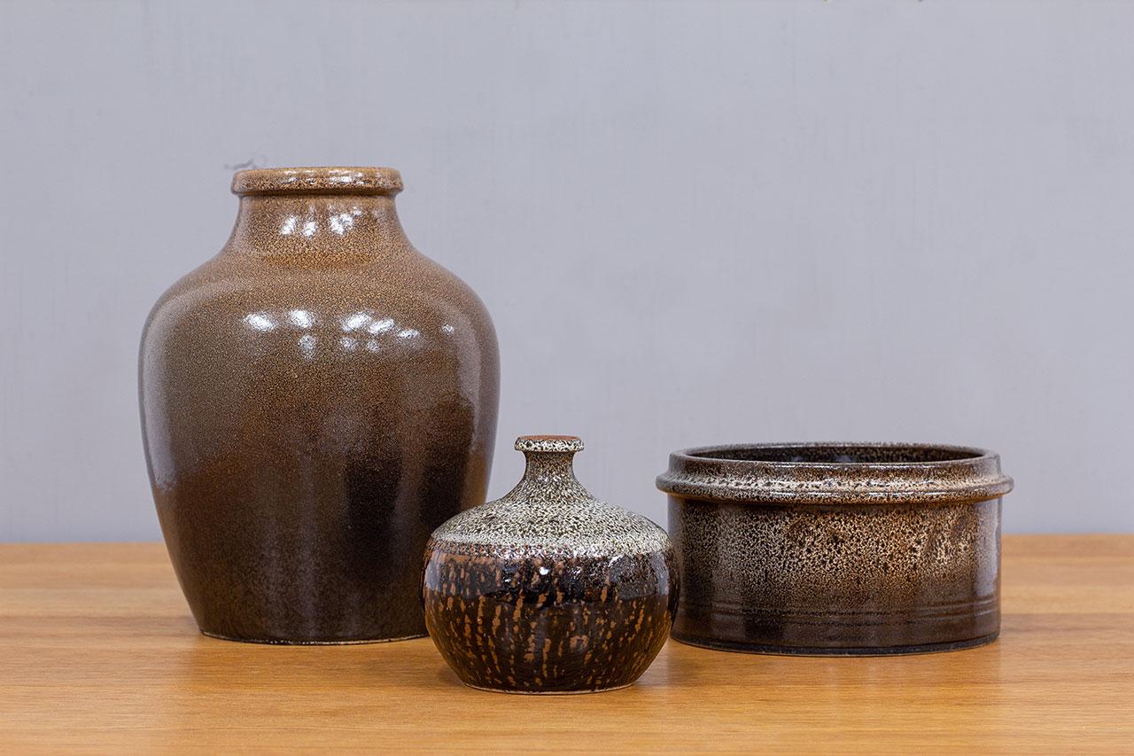 Group of 3 ceramics made by Yngve Blixt, from his own studio at Höganäs AB during the 1970s. Made from stoneware with  speckled  uranium  glaze.
Incised signature on each piece. Production varies from different years during the 1970s.  Each ceramics