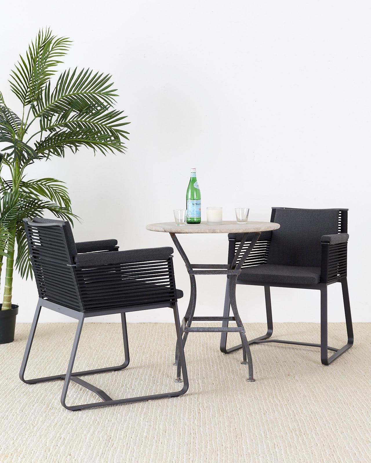 Stylish set of 30 Kettal Studio aluminum dining armchairs landscape design model #941000. These chairs are for indoor and outdoor use constructed from lightweight weatherproof powder coated aluminum. The frame features black rope sides and back with