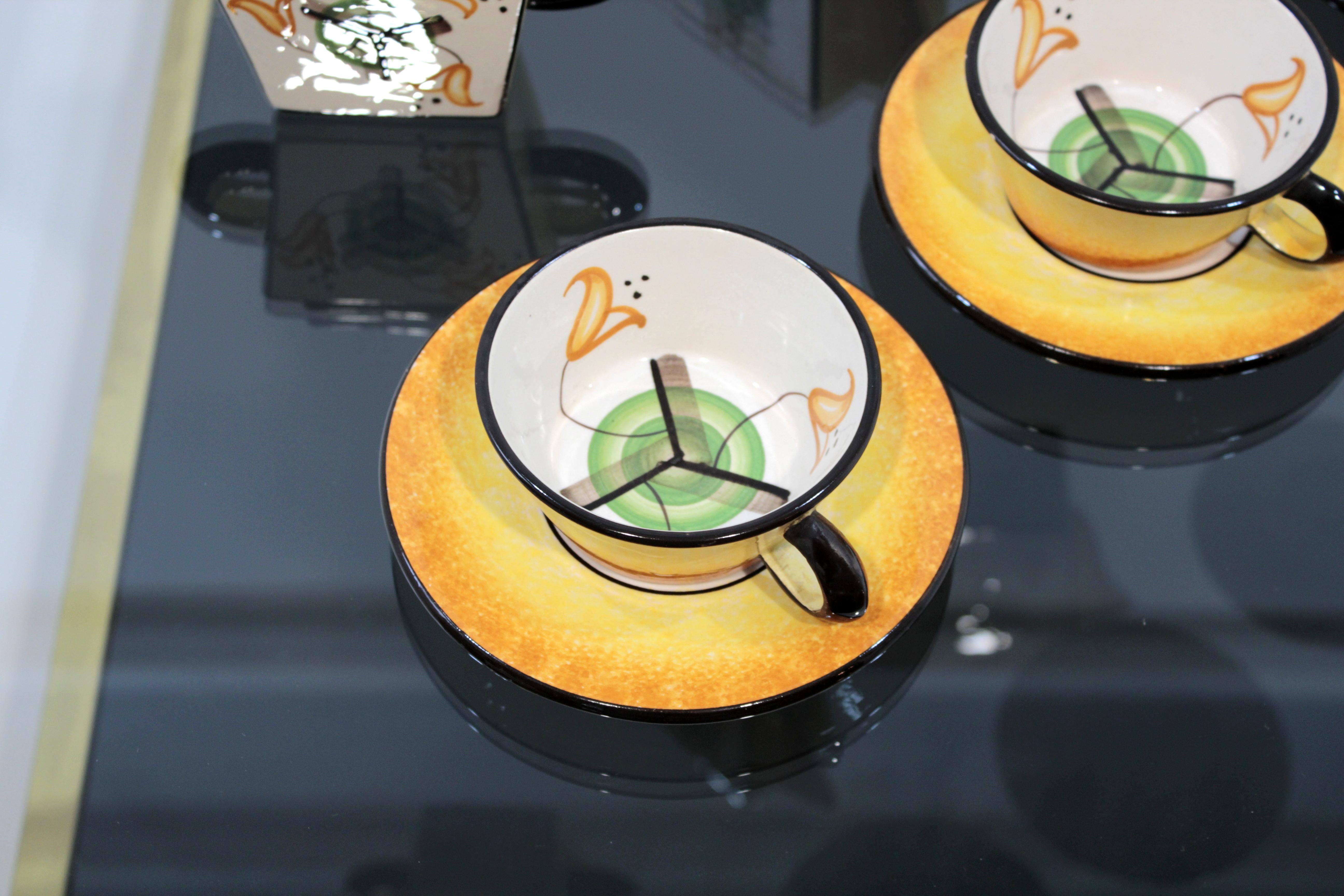 Set of 1930s futurist style hand-painted ceramic Barraud, Messeri & C. tea service or coffee service.

The group is composed by seven pieces among which there are:
- 4 cups
- 1 sugar bowl
- 1 milk jug
- 1 teapot

Below the cup you can read