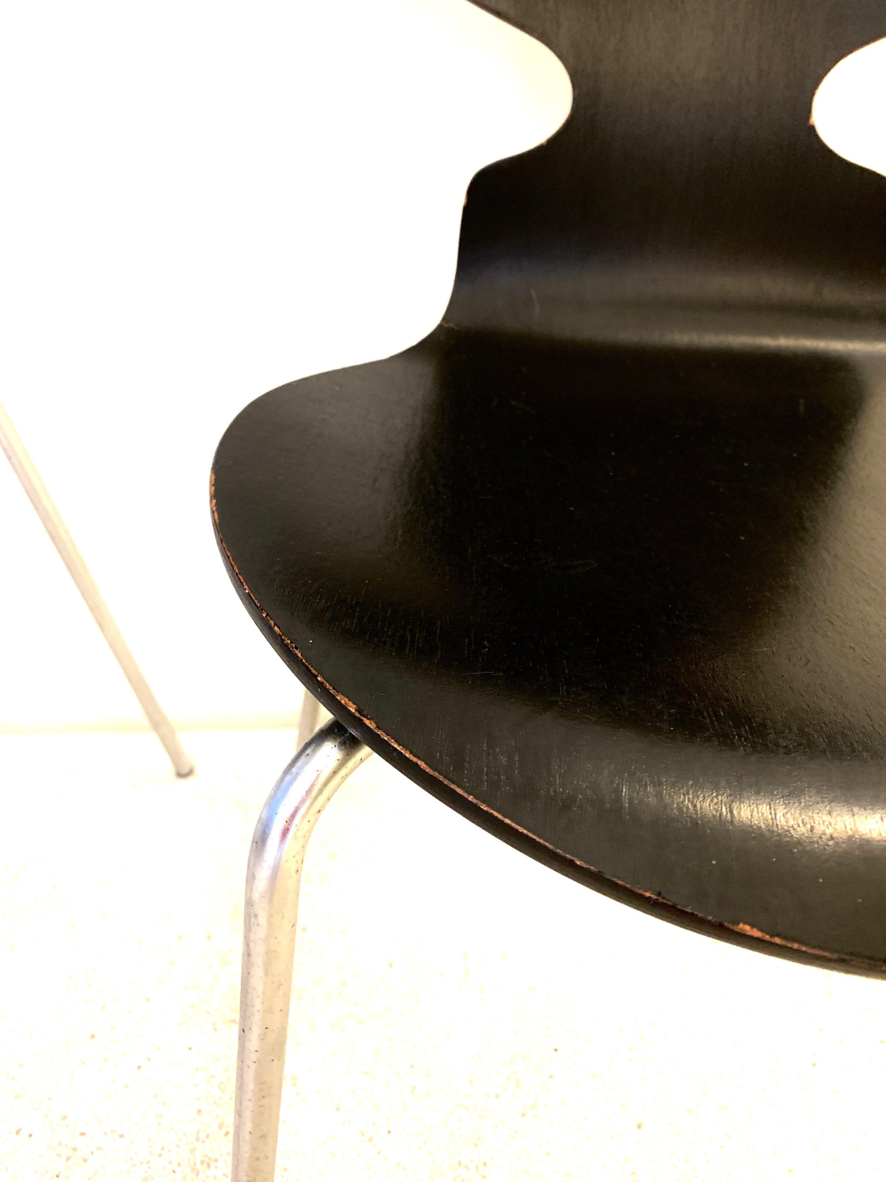 Iconic model 3100 'Ant' chair by Arne Jacobsen for Fritz Hansen.

Model 3101 'Ant' chairs were designed by Arne Jacobsen in 1952. These pieces produced in 1970s. Black lacquered bentwood on steel frame.
 