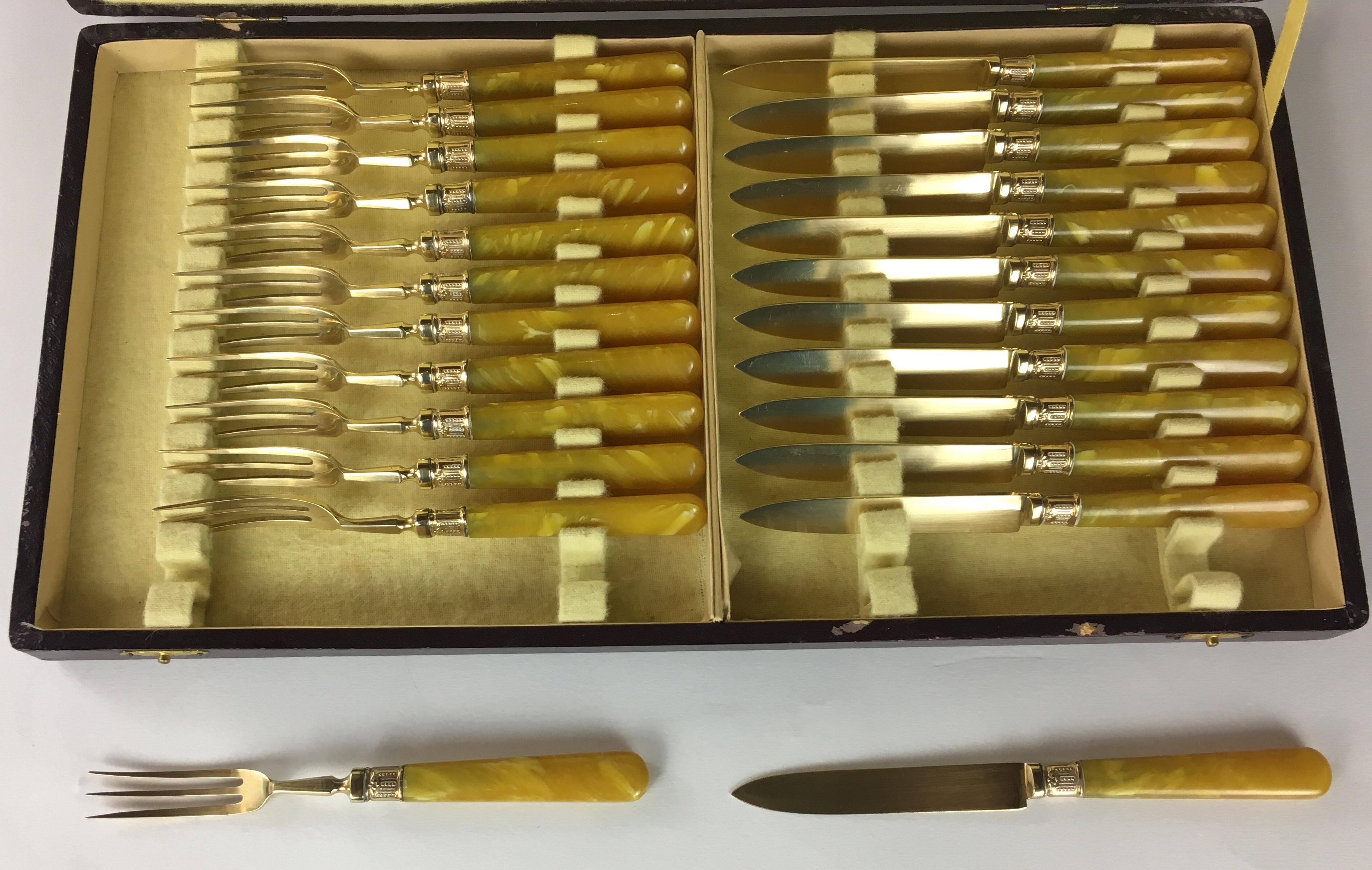 The pricing applies to the entire set of 36 French gold-plated oyster forks set twelve pieces, dessert forks and knives twenty four pieces. All with mother-of-pearl handles and solid gold ferrules. This complete set is sold with their original boxes