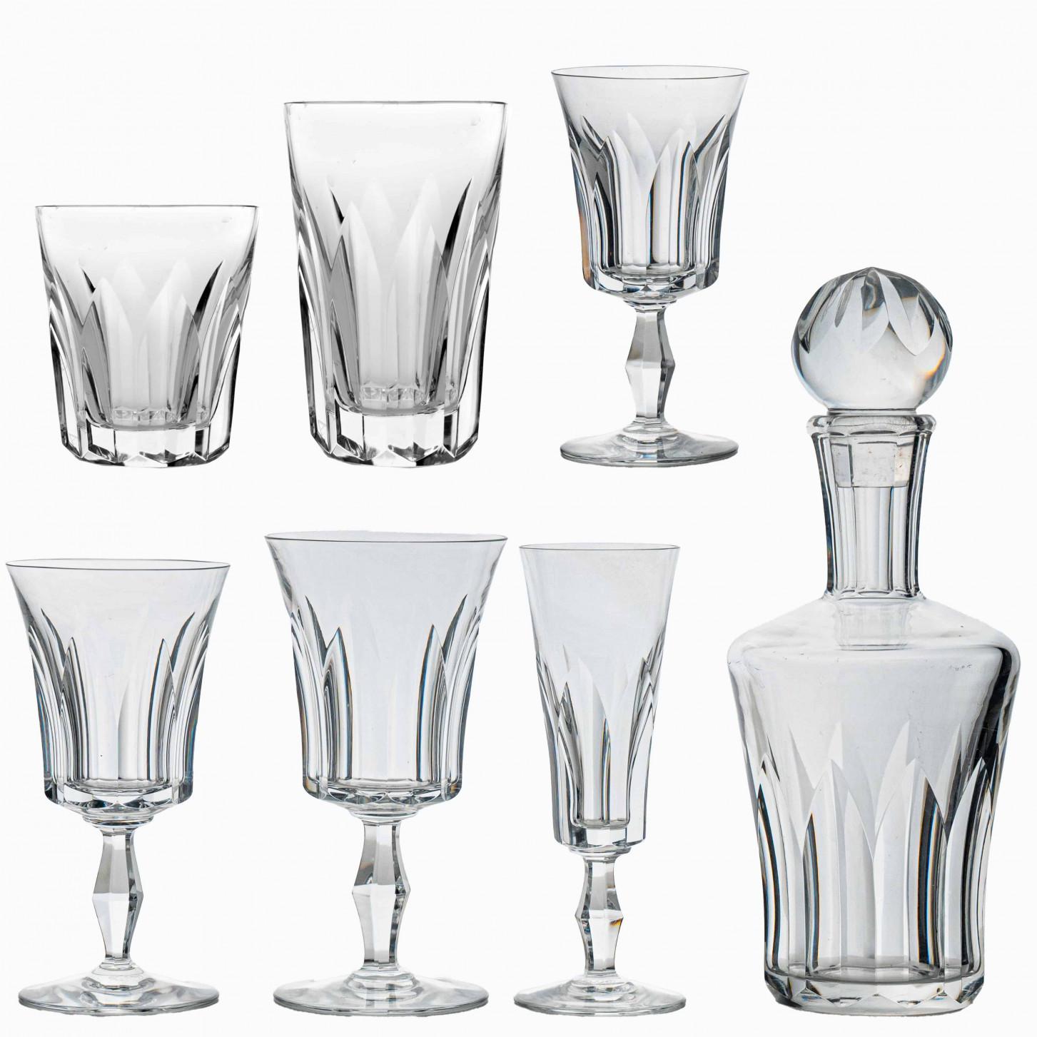 Luxury at its finest, set of 24 high-end drink glasses in clear crystal and 1 decanter by Baccarat.

The Polignac glassware showcases Baccarat’s meticulous craftsmanship. Deep orgue bevel cuts are etched directly into the Clear crystal, radiating