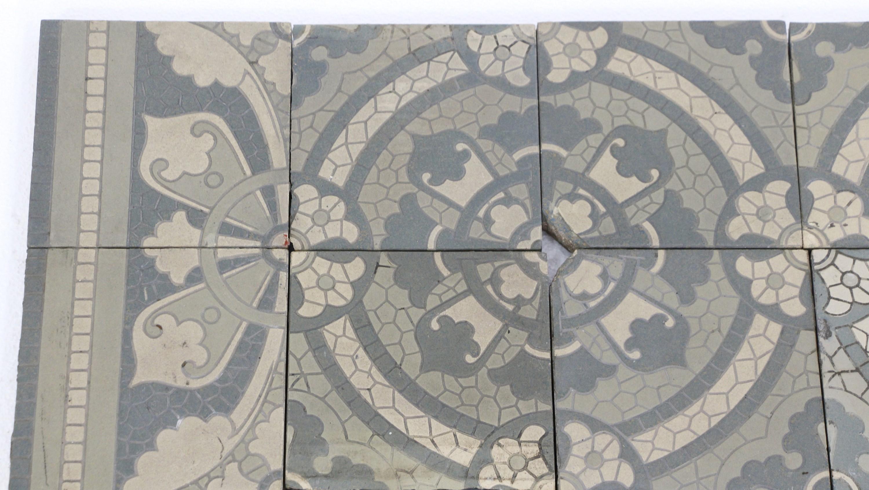 Encaustic floor tile made by Villeroy and Boch. they were reclaimed from a convent that was built in the early 1900s. They feature floral and foliate details in earth tone colors and border tiles with blue fields. These are textured heavy tiles.