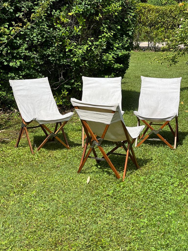 Pair of folding armchairs in wood and metal from the 1930 Art Deco Croisière Jaune, with heavy-duty cotton canvas. 
Signed on the metal 
