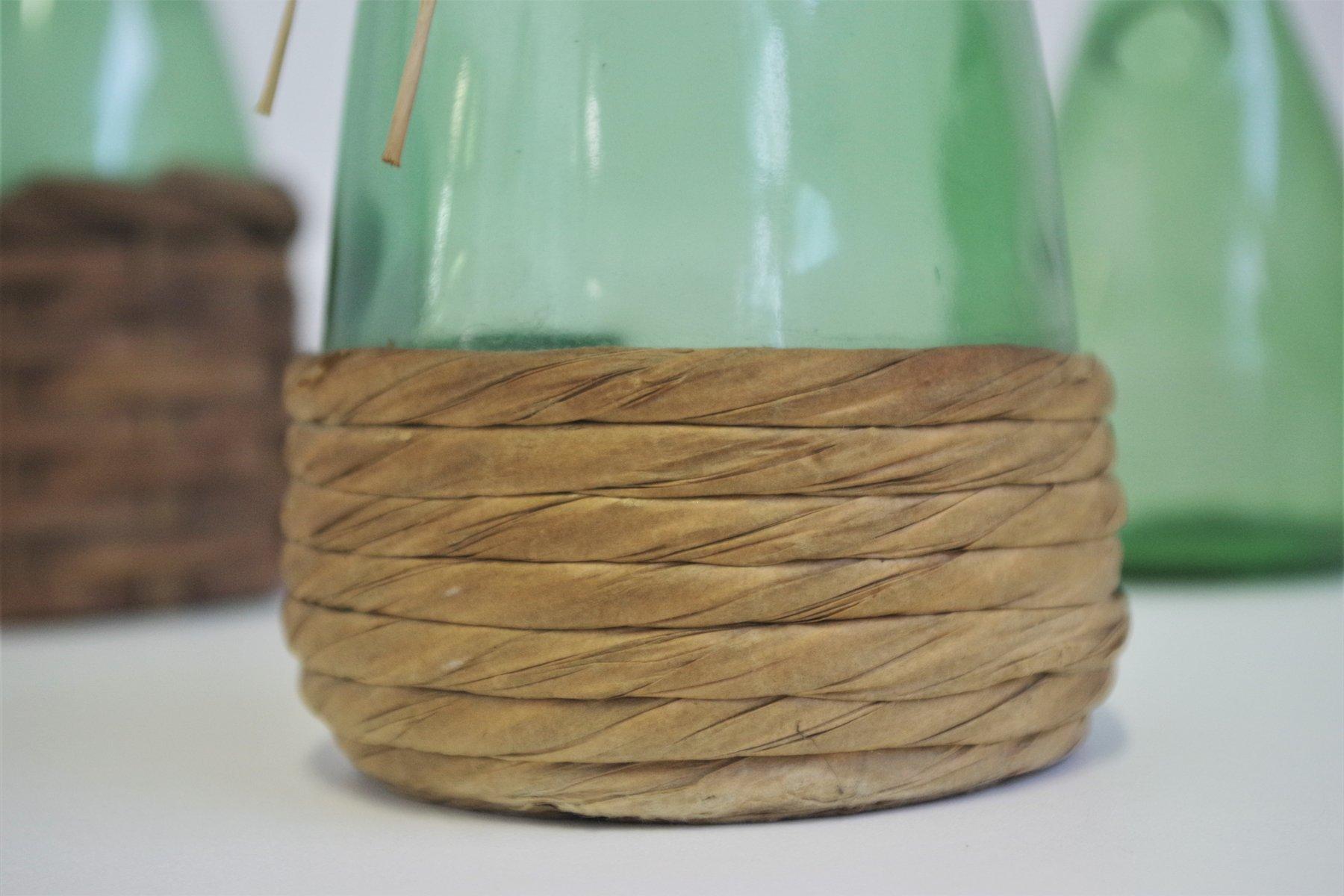 Set of 4 1950s Green Glass Decanters with Straw - Rustic Charm

Enhance your collection with this set of four decanters from the 1950s, crafted in green glass and accented with natural straw details. Each piece exudes vintage Italian character,