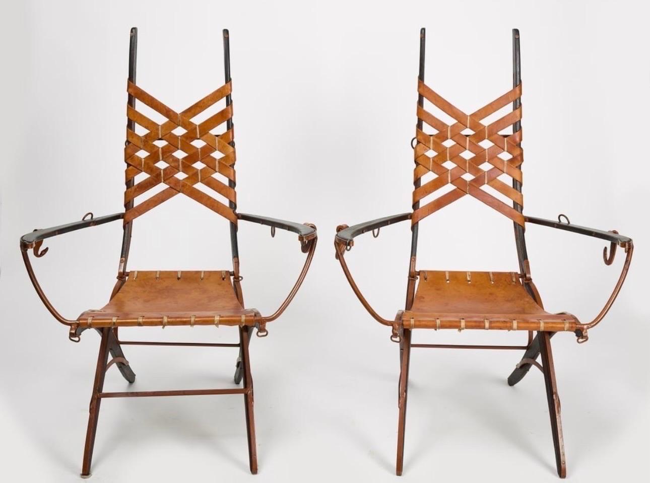 A set of 4 Italian armchairs by Alberto Marconetti. These detailed chairs are made of iron, leather and wood. 
Beautiful craftsmanship, these chairs have great detail. The chairs are all stamped A. Marconetti on the leather straps on back.
The