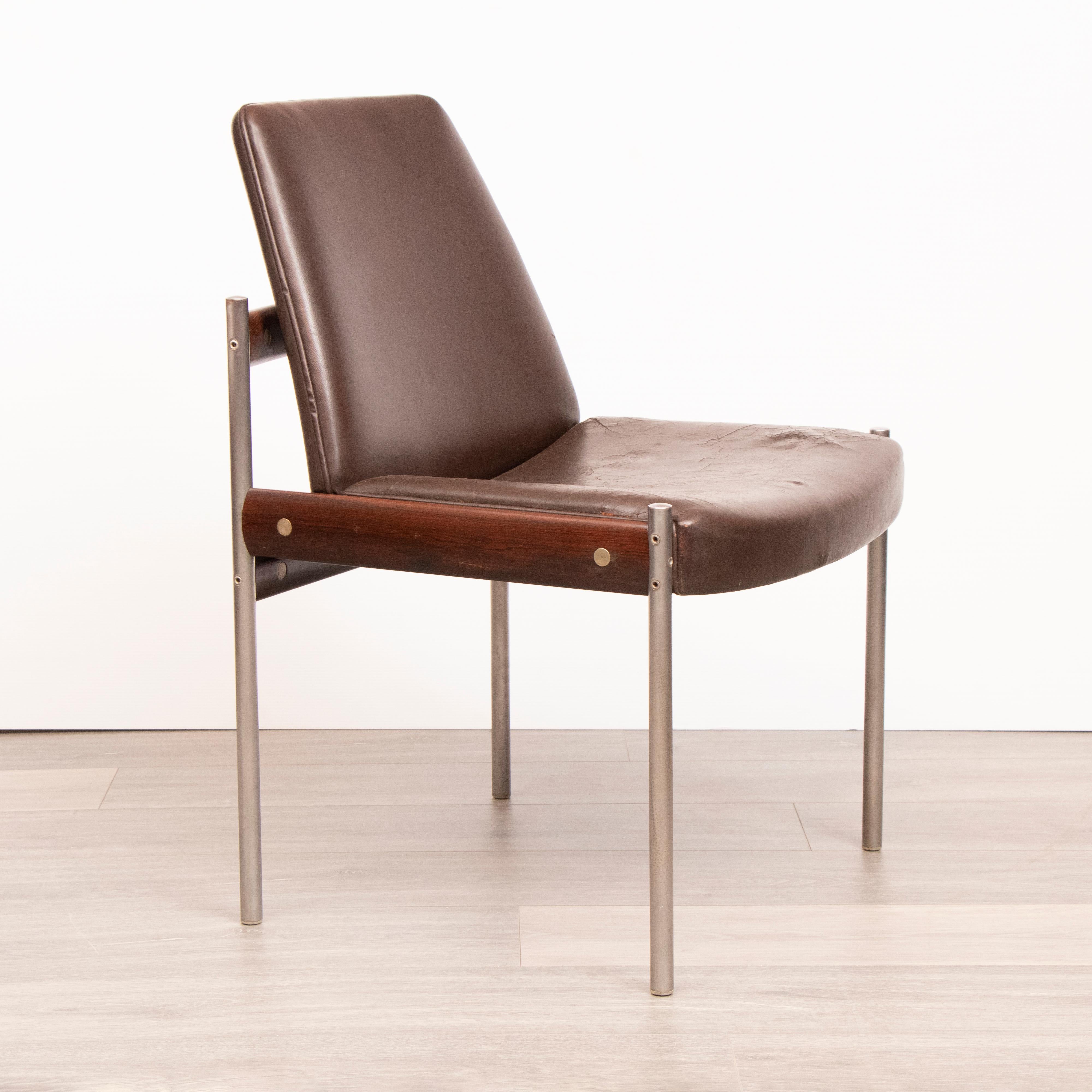 Set of 4 original dining chairs designed by Sven Ivar Dysthe and manufactured by Dokka Mobler in Norway. The frame is manufactured from a combination of Rosewood, chrome-plated metal tubes and brown leather upholstery.

The original brown leather