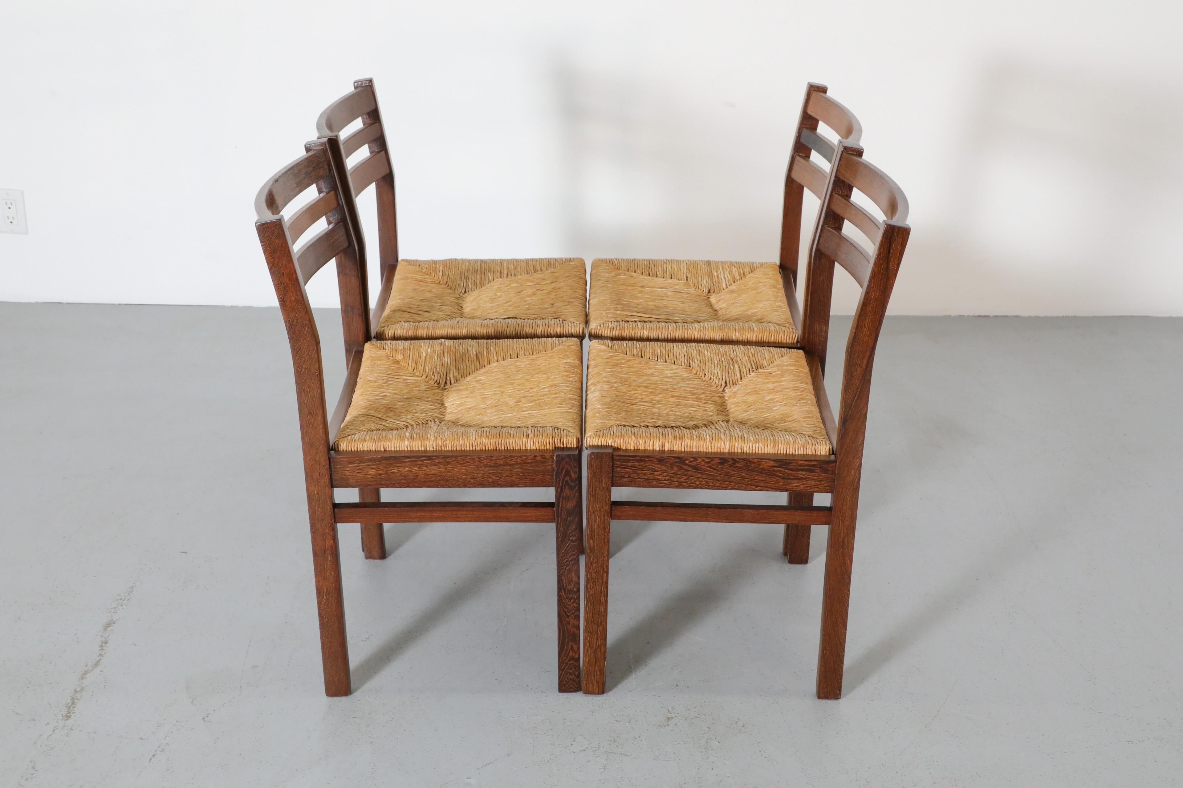 Set di quattro sedie da pranzo in wengé e giunco di Martin Visser degli anni '60 per 't Spectrum In condizioni buone in vendita a Los Angeles, CA