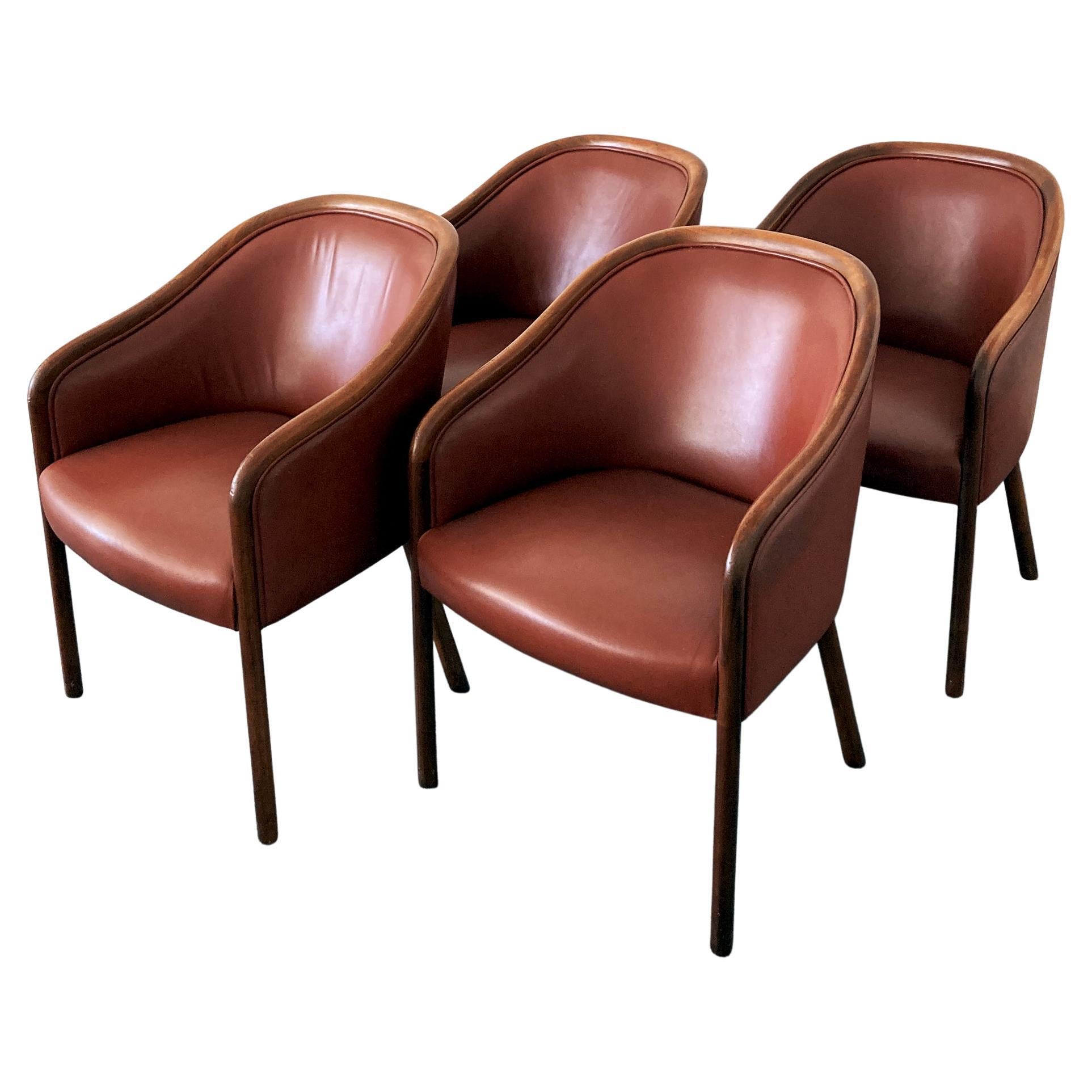 Designed by Ward Bennett for Brickel Associates, elegant leather armchairs. Made from ash wood and stained in a walnut finish, upholstered in leather. Stunning set of chairs, leather is in good condition. The chairs are structurally sound and