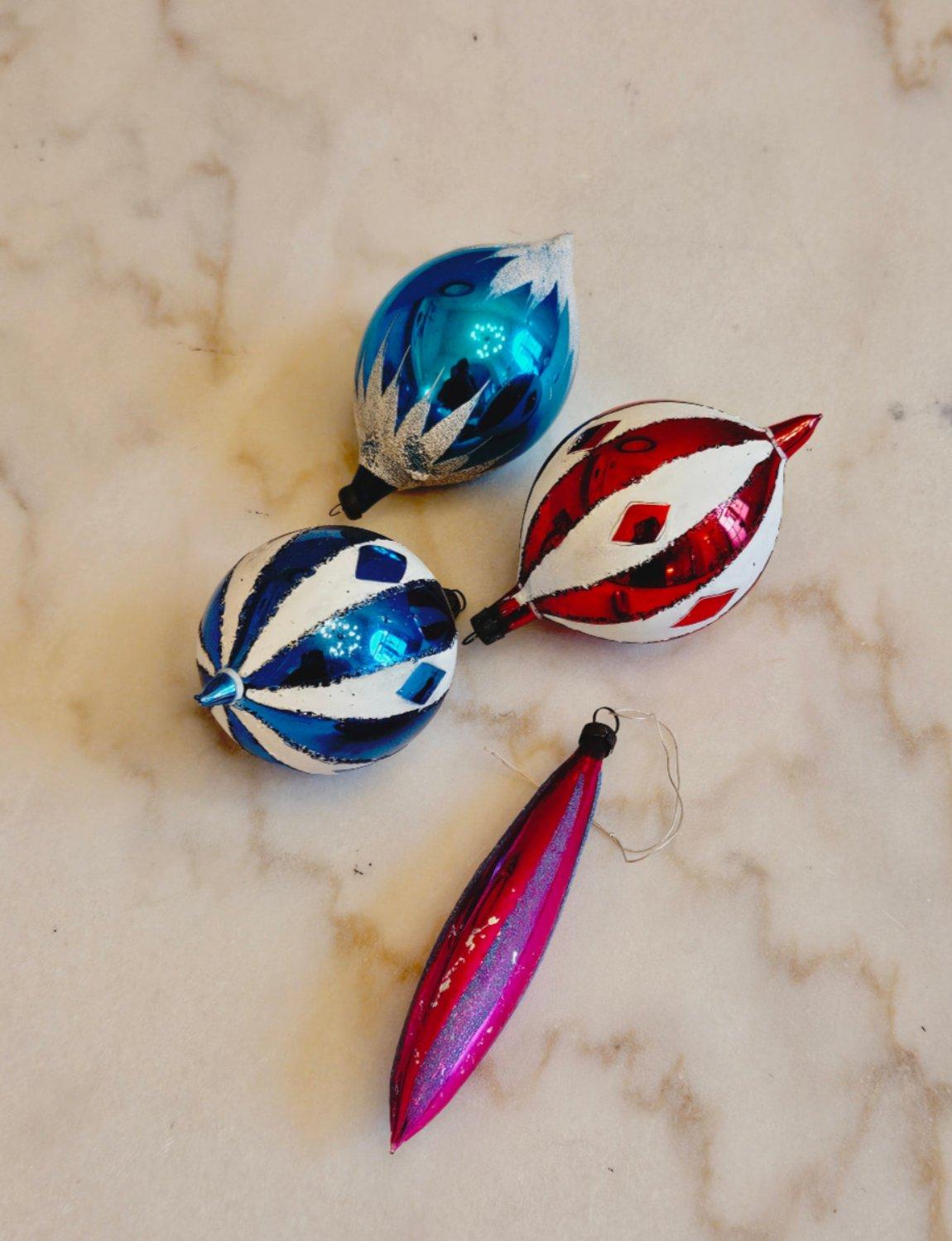 A set of four beautifully coloured 1960s/1970s vintage glass Christmas tree baubles. These pieces are incredibly colourful and fragile.

Dimensions: each bauble approx H10cm x W7cm