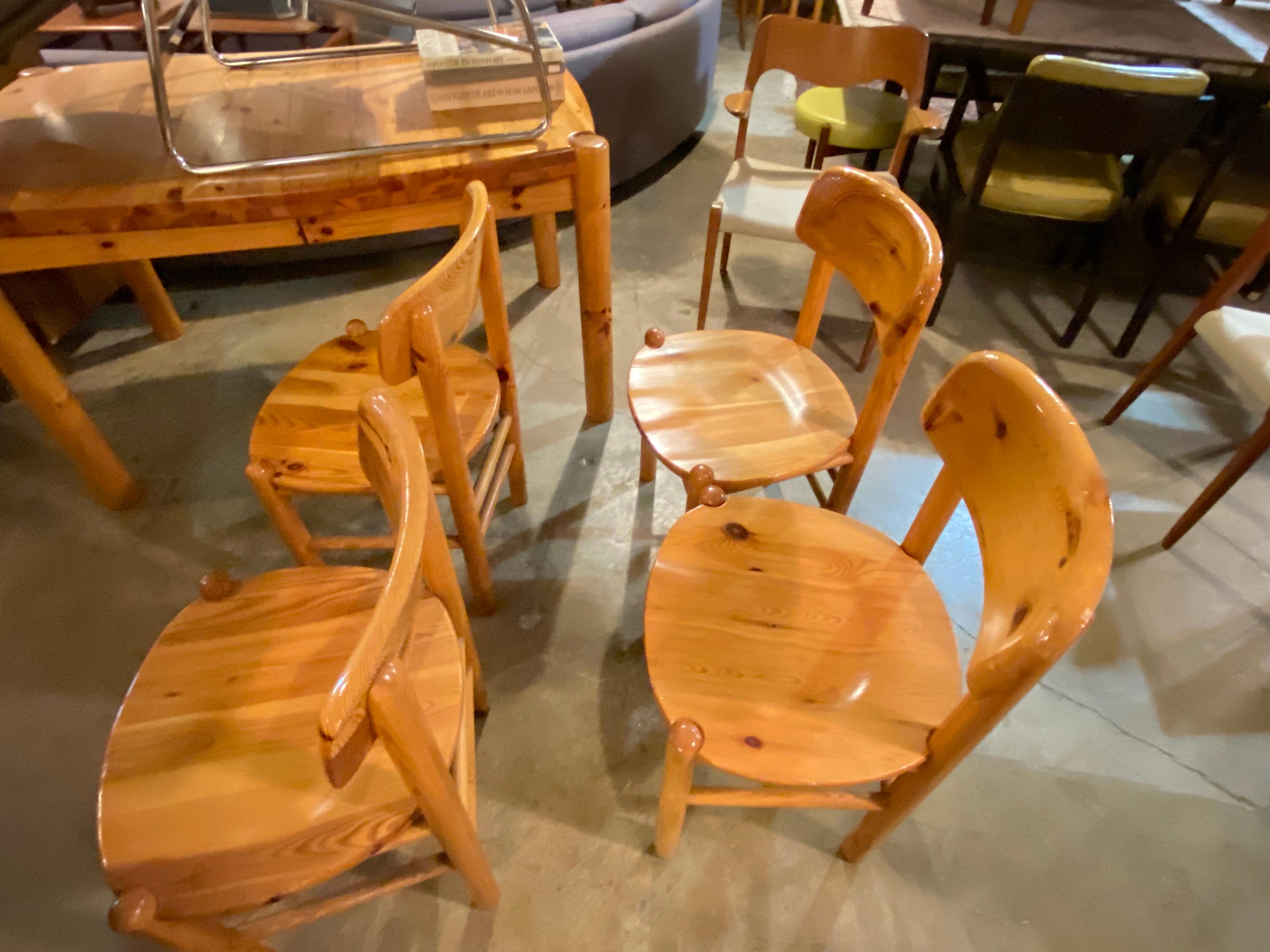 Designed by architect and designer, Rainer Daumiller this set of 4 vintage solid pine dining chairs have rounded edges with no arms and are in good condition.