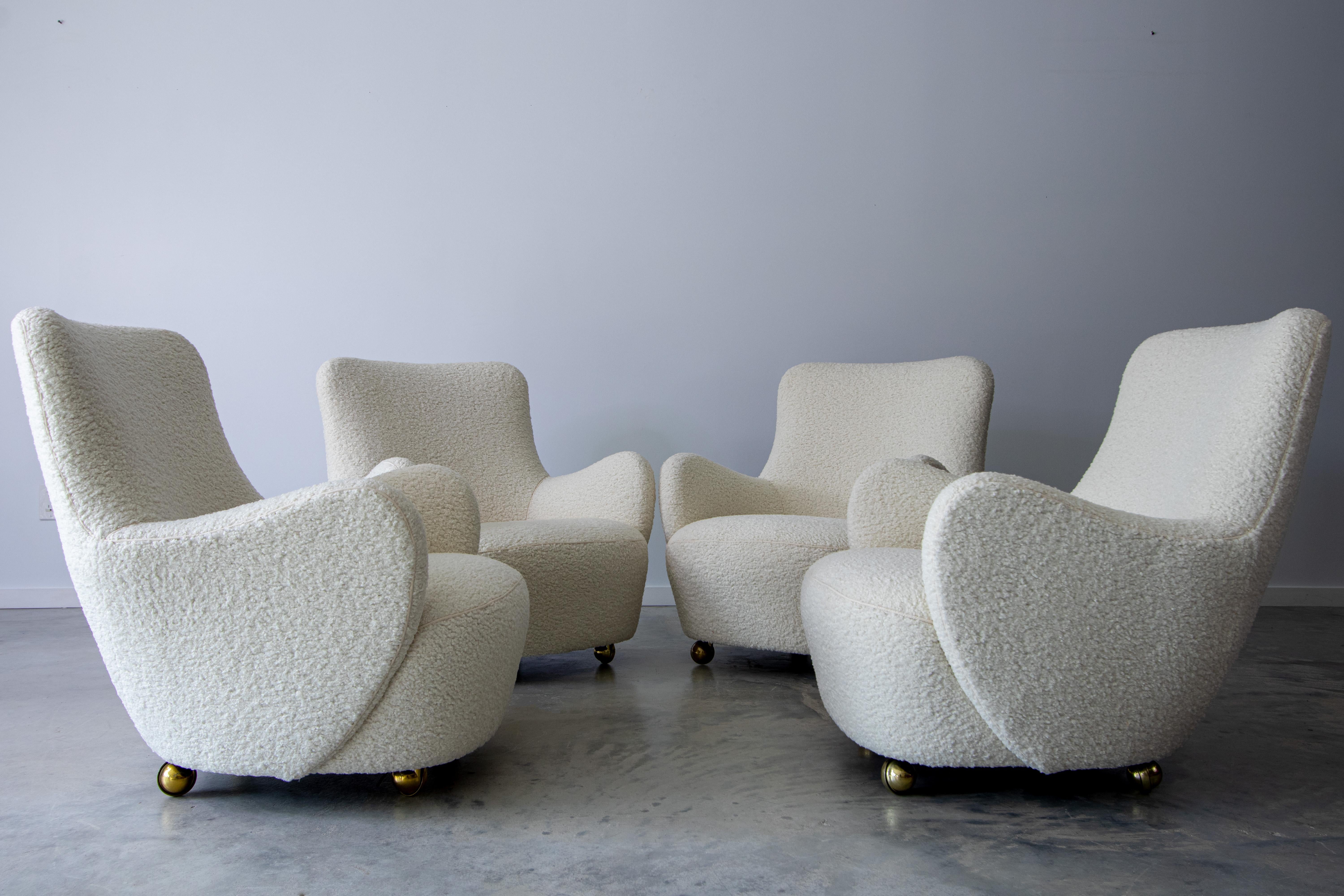 Set of four early “barrel” chairs, model 100a, designed by Vladimir Kagan for Kagan-Dreyfuss. This set has been reupholstered in a white boucle fabric.

Dimensions:

W30” x D32.5” x H31.75” Seat Height 14”

Condition:

Newly Upholstered.