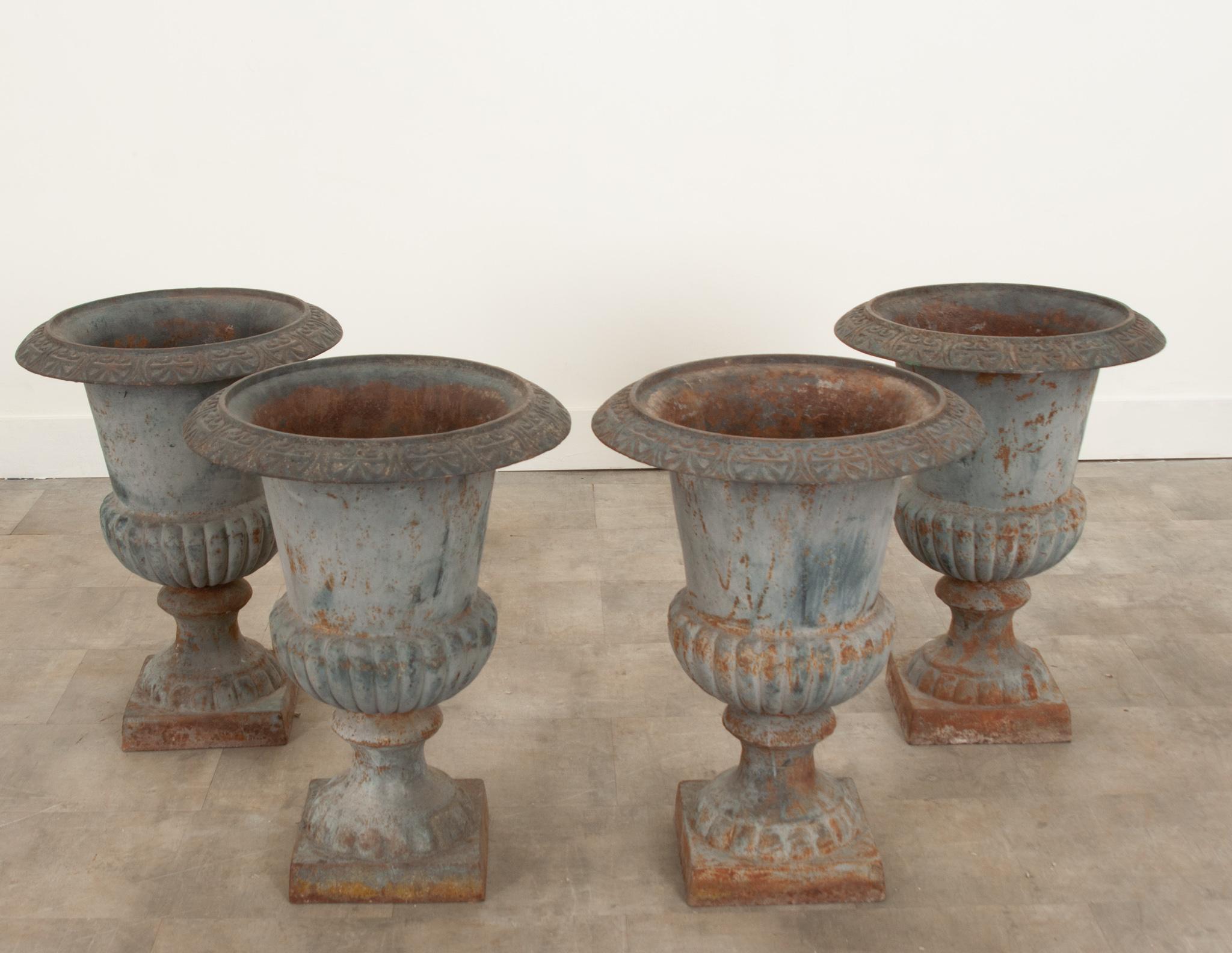 A fantastic set of four iron garden planters from France crafted during the 19th Century. Wonderfully patinated from decades of outdoor exposure and weathering, they add so much character to any space. The basin opening measures 13” diameter and