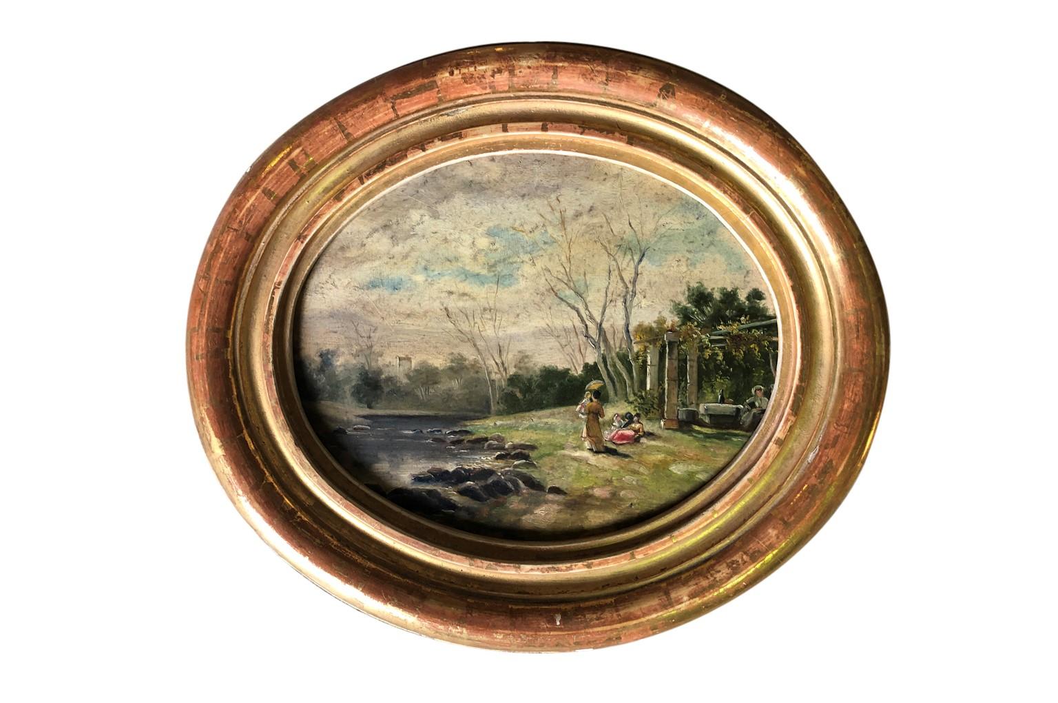 A charming set of 4 oval shaped 19th century oil on board paintings of the Majorcan countryside housed in their handsome giltwood frames. A very lovely collection.