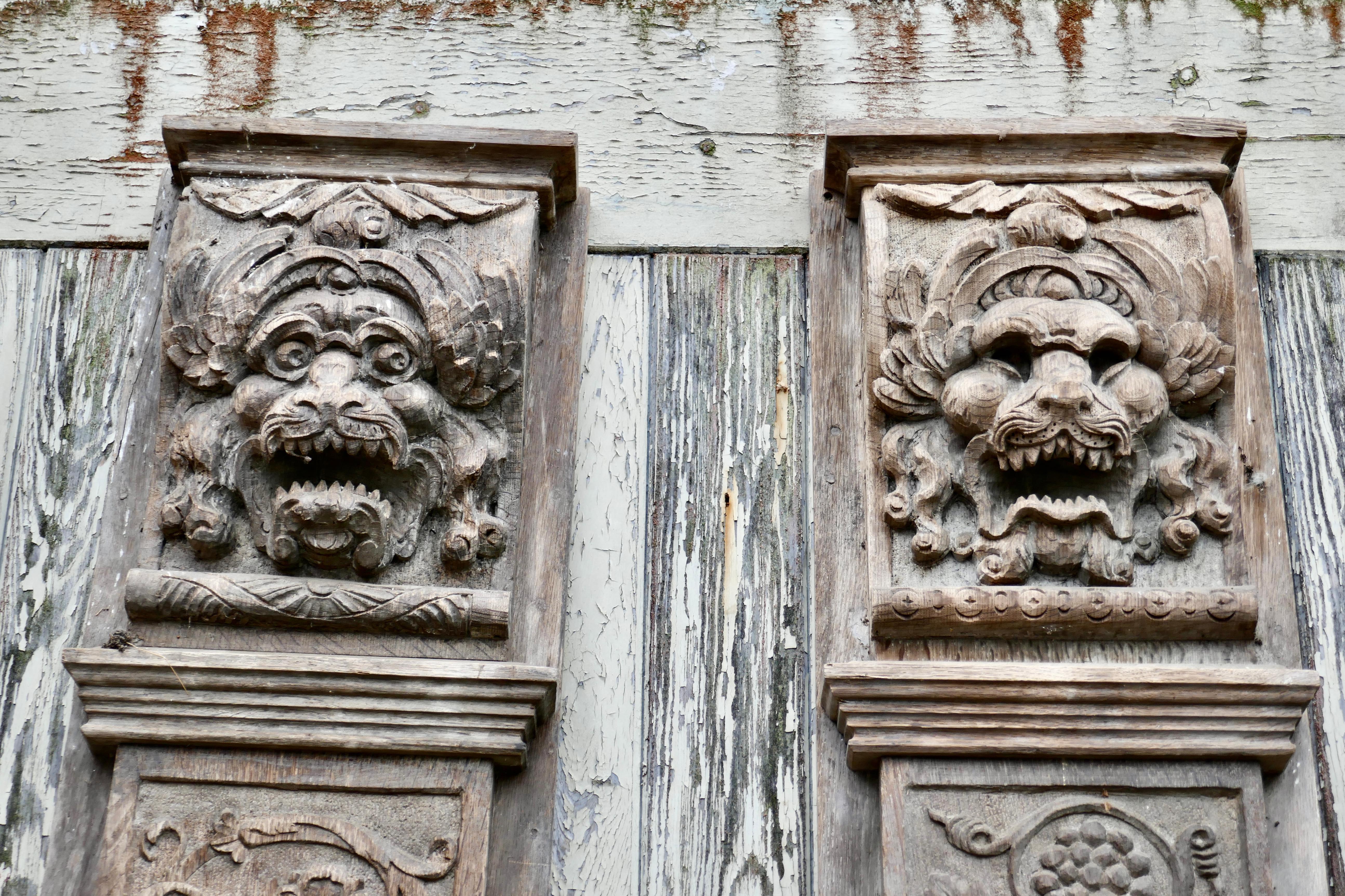 Set of 4, 8ft tall 18th century carved oak wall panels

Each of the columns has a deeply carved grotesque mask set on the top with the panel below carved with other mythical characters, fruits, flowers and acanthus leaves 
These are very tall