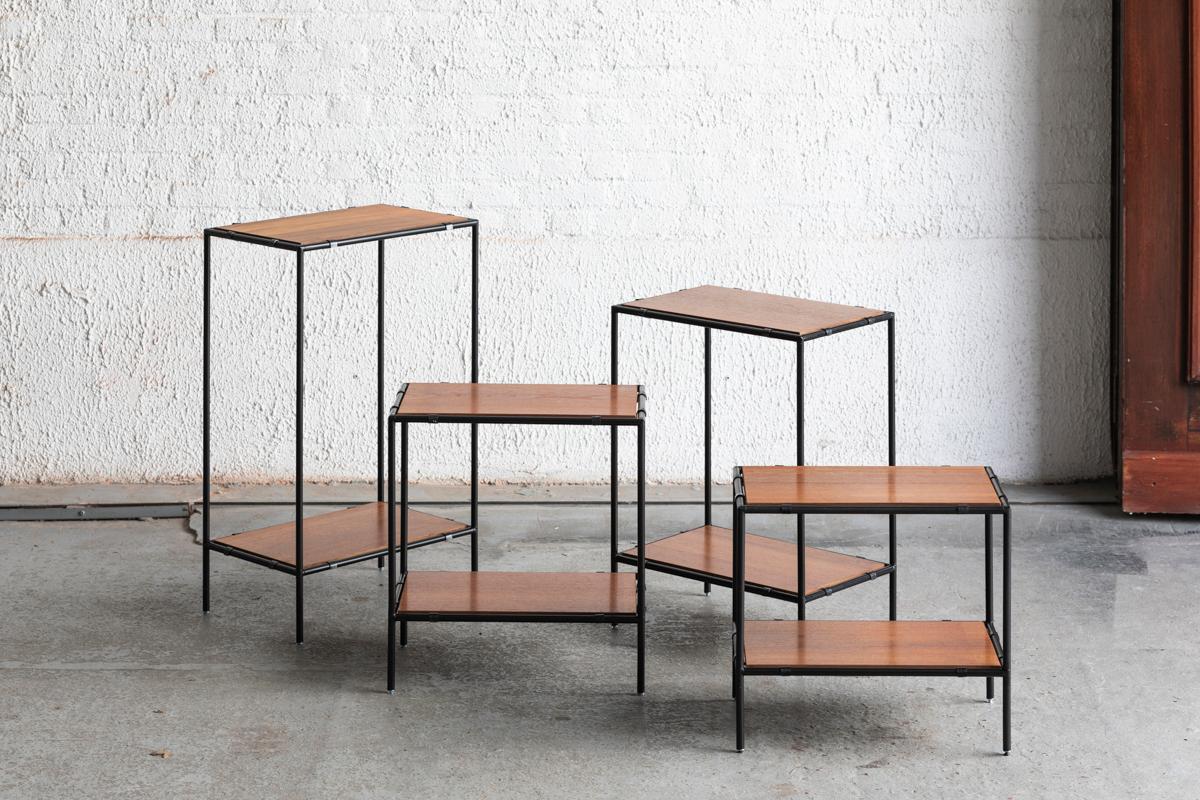 Set ‘Abstracta’ shelving units designed by P. Cadovius in Denmark around 1960. This unit consist of 4 shelving pillars of different height. They all feature a black coated steel frame and teak veneer shelves. In good condition with some small wear