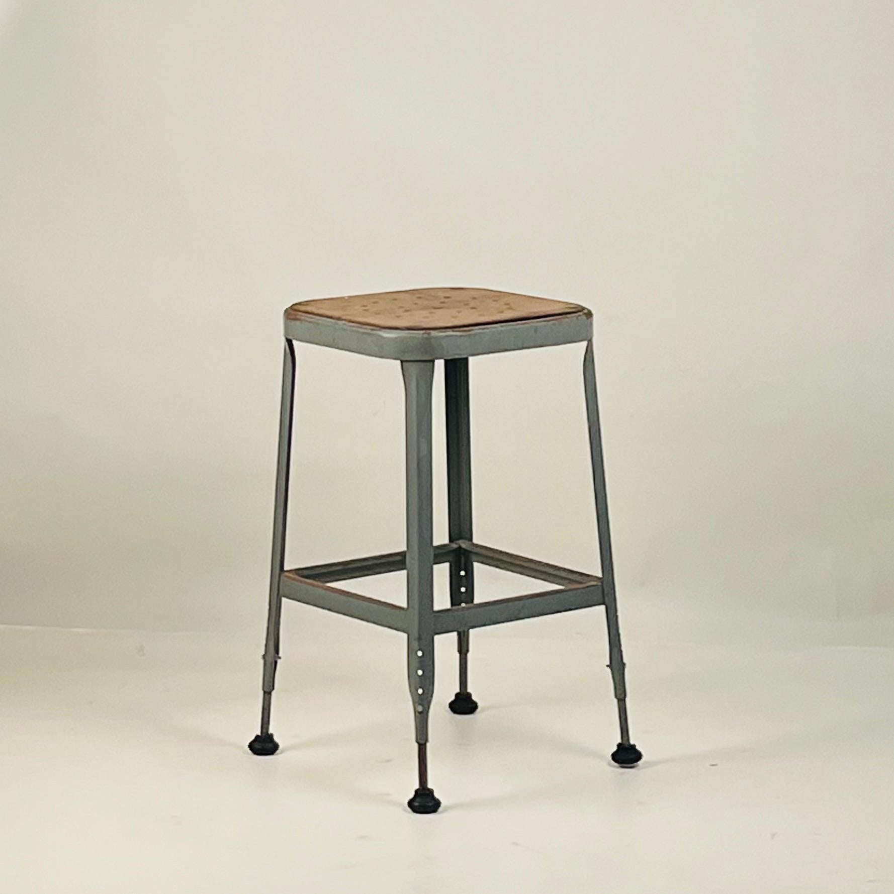 Set of 4 Adjustable Patinated Steel Counter Stools by Lyon Manufacturing In Fair Condition For Sale In Los Angeles, CA