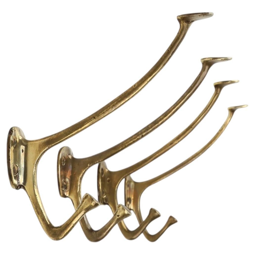 Set of 4 Adolf Loos brass art nouveau wall hooks, Vienna, Austria ca. 1910