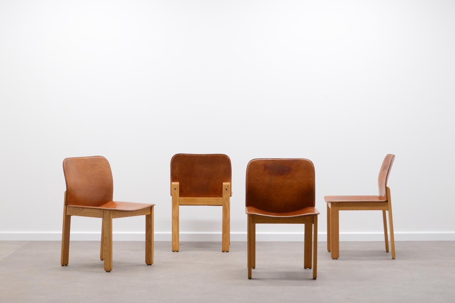 Set of beautiful chairs in very good condition.

Designed by Afra & Tobia Scarpa 

Produced in Italy in the 1970s 

The seat of these chairs is made from thick natural leather with a beautiful patinated cognac color.

The frame is made from