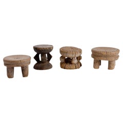 Set of 4 African carved wood stools