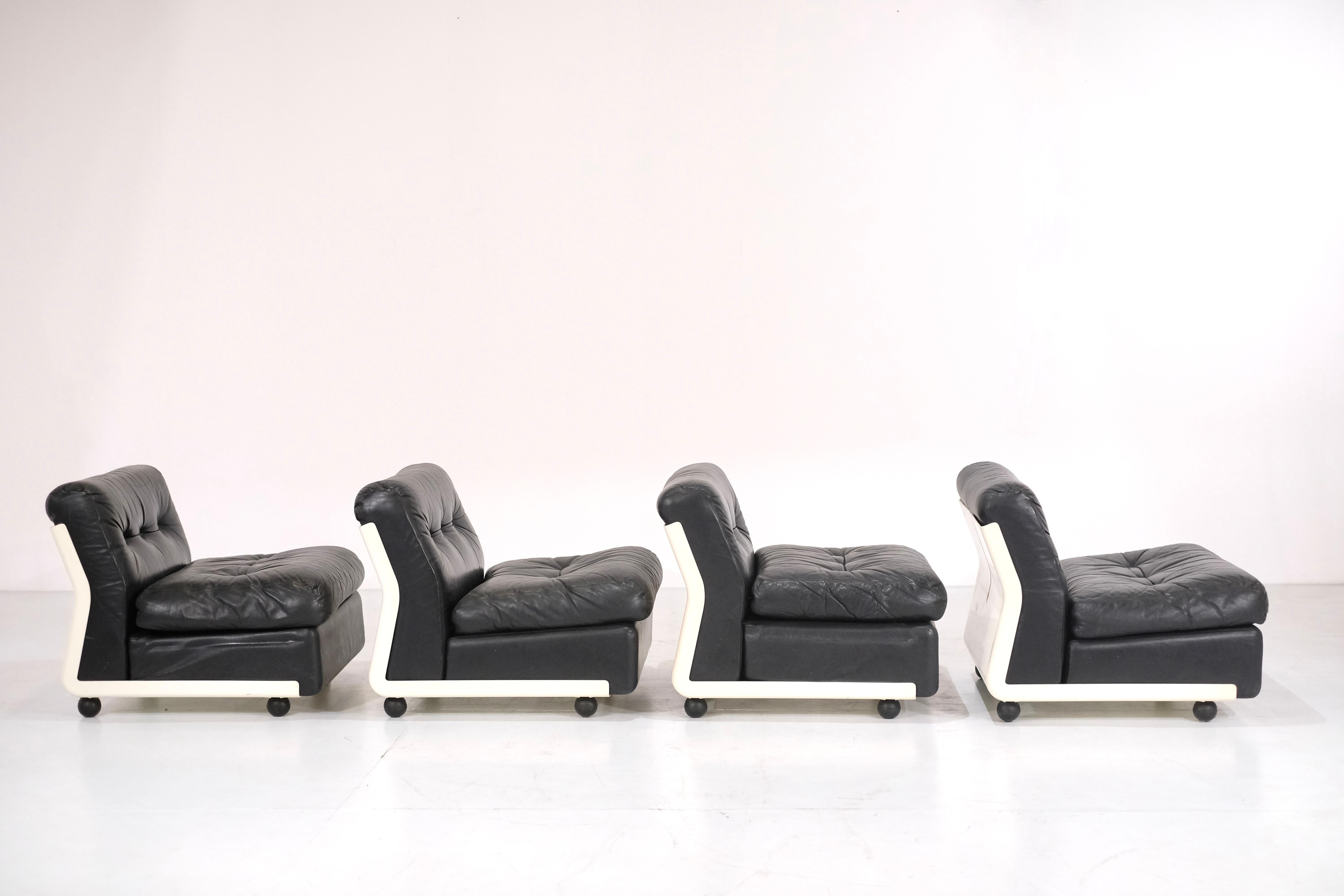 Amazing set of 4 Amanta armchairs in black leather  designed by Mario Bellini for C&B Italia in 1966.

The leather is in really good shape with an amazing patina. They are in really good shape with some signs of use due to the lifetime of the