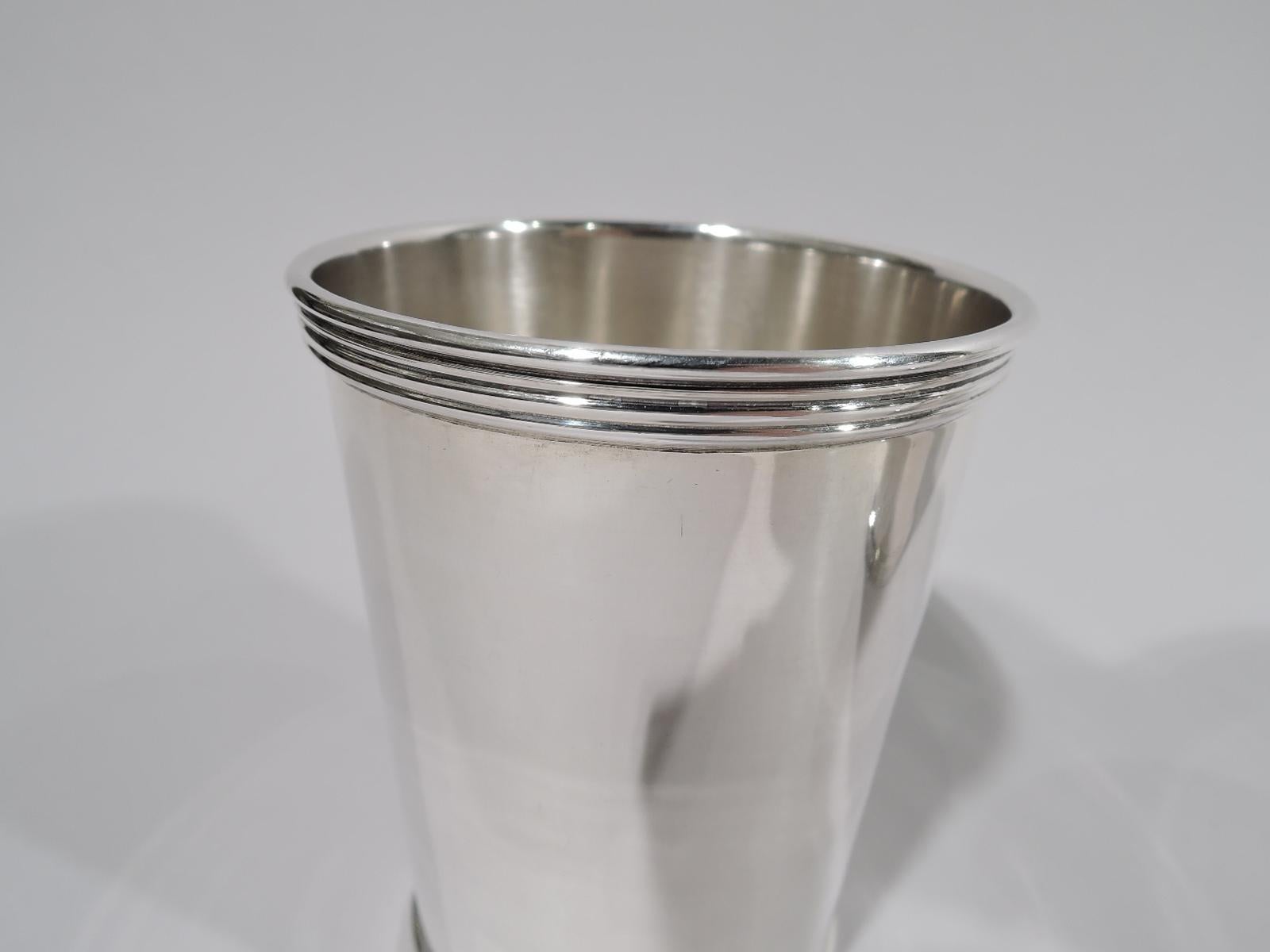 Set of 4 sterling silver mint juleps. Made by Wm Rogers Mfg Co. (part of International) in Hartford. Each: Straight and tapering sides, and reeded rim and base. A quartet of cups for a select Derby Day celebration. Fully marked. Two cups numbered