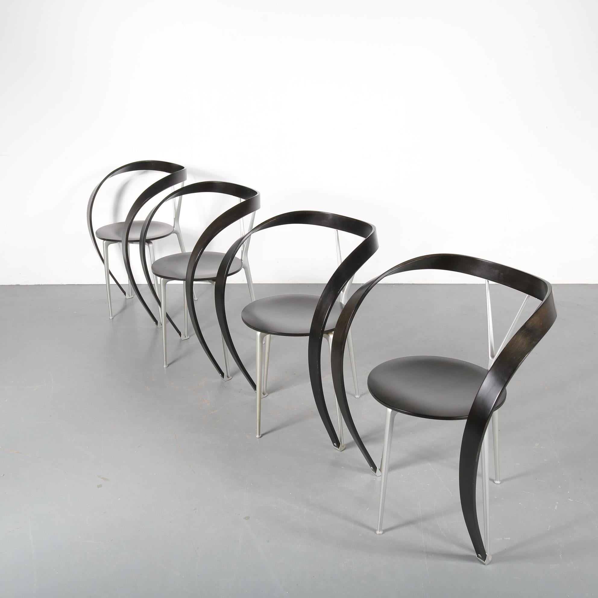 An beautiful set of four luxurious chairs, model “Revers”, designed by Andrea Branzi and manufactured by Cassina in Italy, circa 1990.

The main eye-catching feature of these chairs are the smoothly bent armrests. Each chair has an integrated