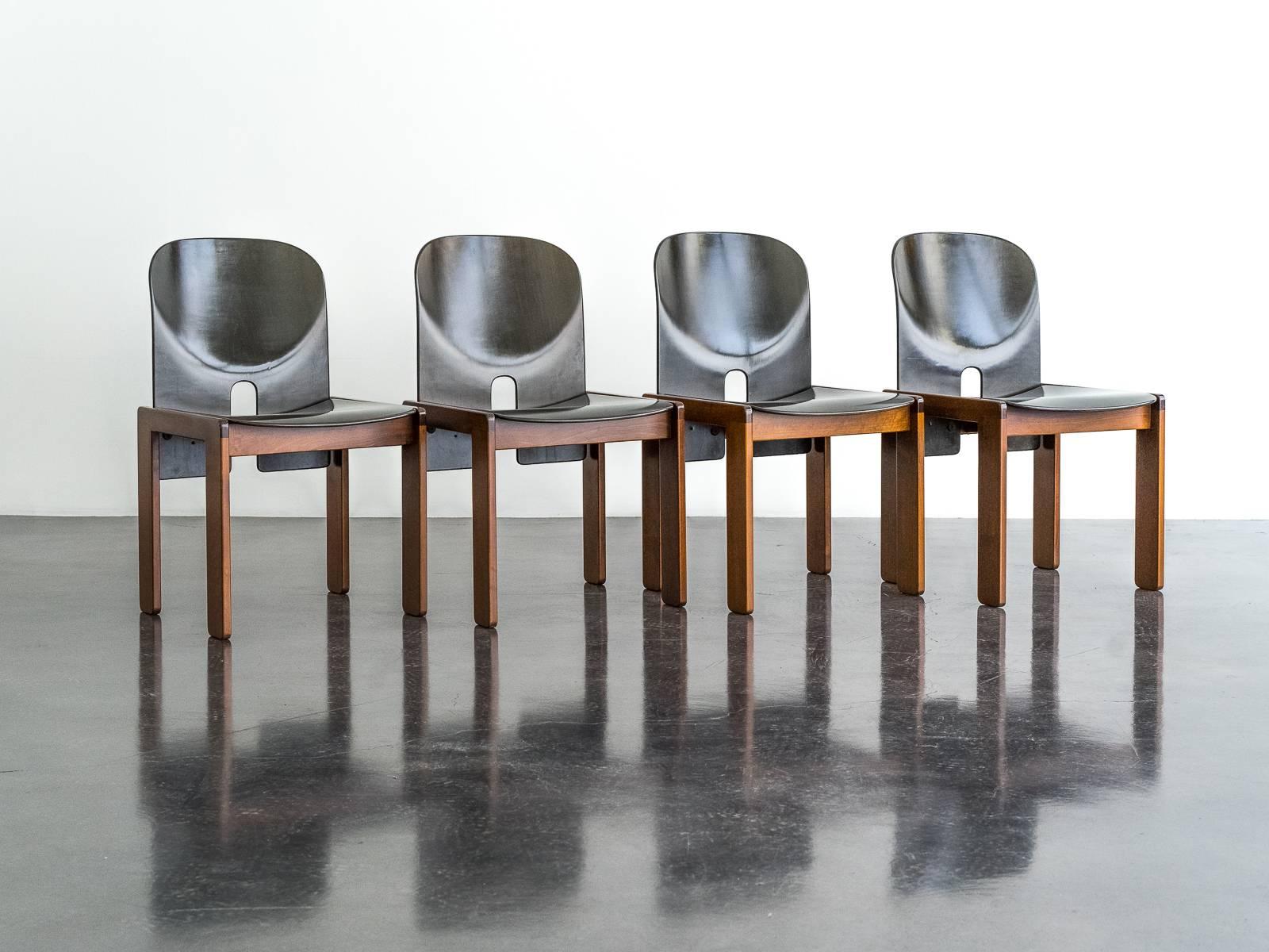 A set of four aniline-dyed ‘Mod. 121’ chairs designed by Afra & Tobia Scarpa for Cassina in 1965. The gorgeous aniline finish highlights the woodgrain and creates a beautiful sheen and depth of color as it shifts from deep black to dark green in