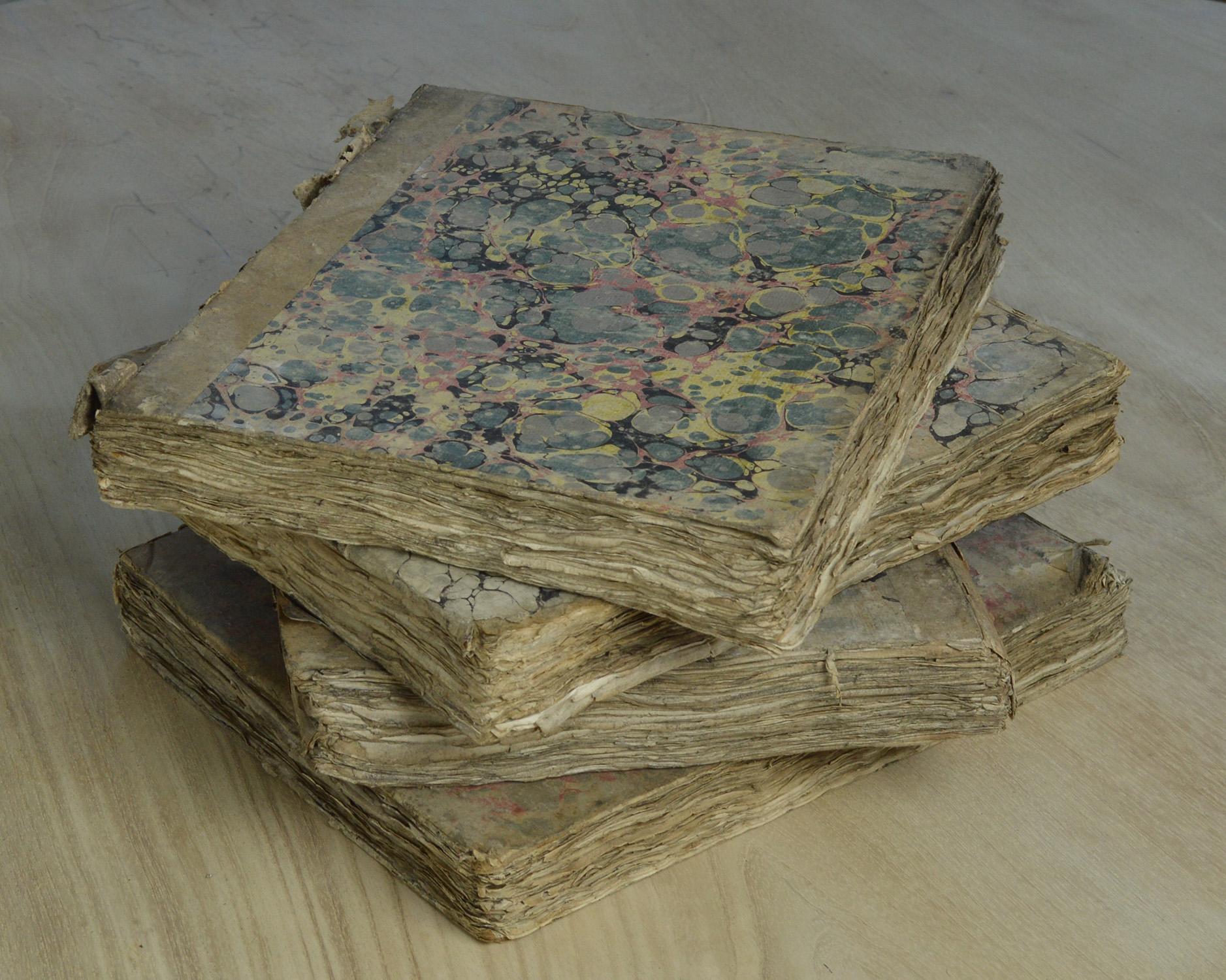 Wonderfully distressed books with marbleized boards and equally beautiful fore edges.

They are random volumes of The Encyclopaedia Britannica, 1797.

One of the books is lacking its back board.




     
