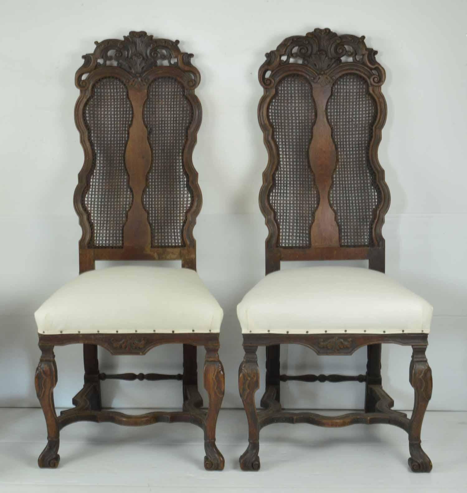 Sensational set of 4 carved walnut chairs.

Beautifully carved.

Newly upholstered in calico.

Lovely old patch repair to one of the backs of the top rail.

One of the side stretchers has been replaced.

There is some damage to a small