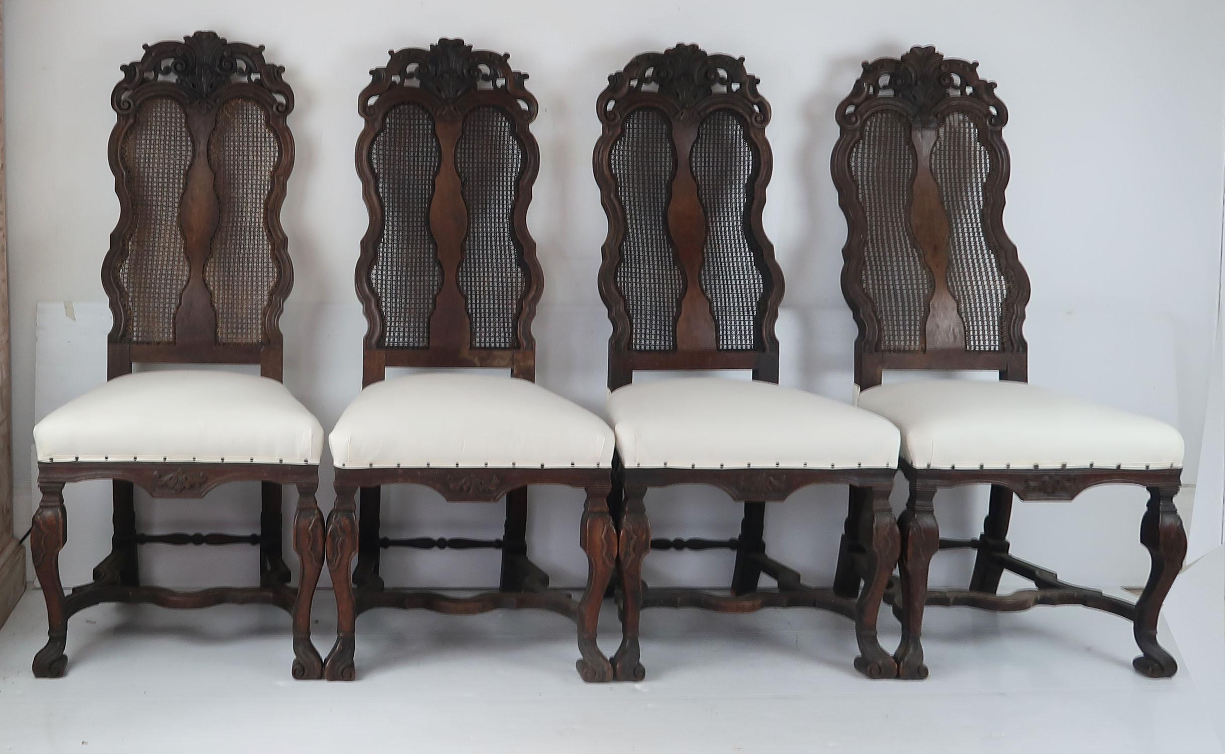 Sensational set of 4 carved walnut chairs.

Beautifully carved.

Newly upholstered in calico.

Lovely old patch repair to one of the backs of the top rail.

One of the side stretchers has been replaced.

There is some damage to a small area of