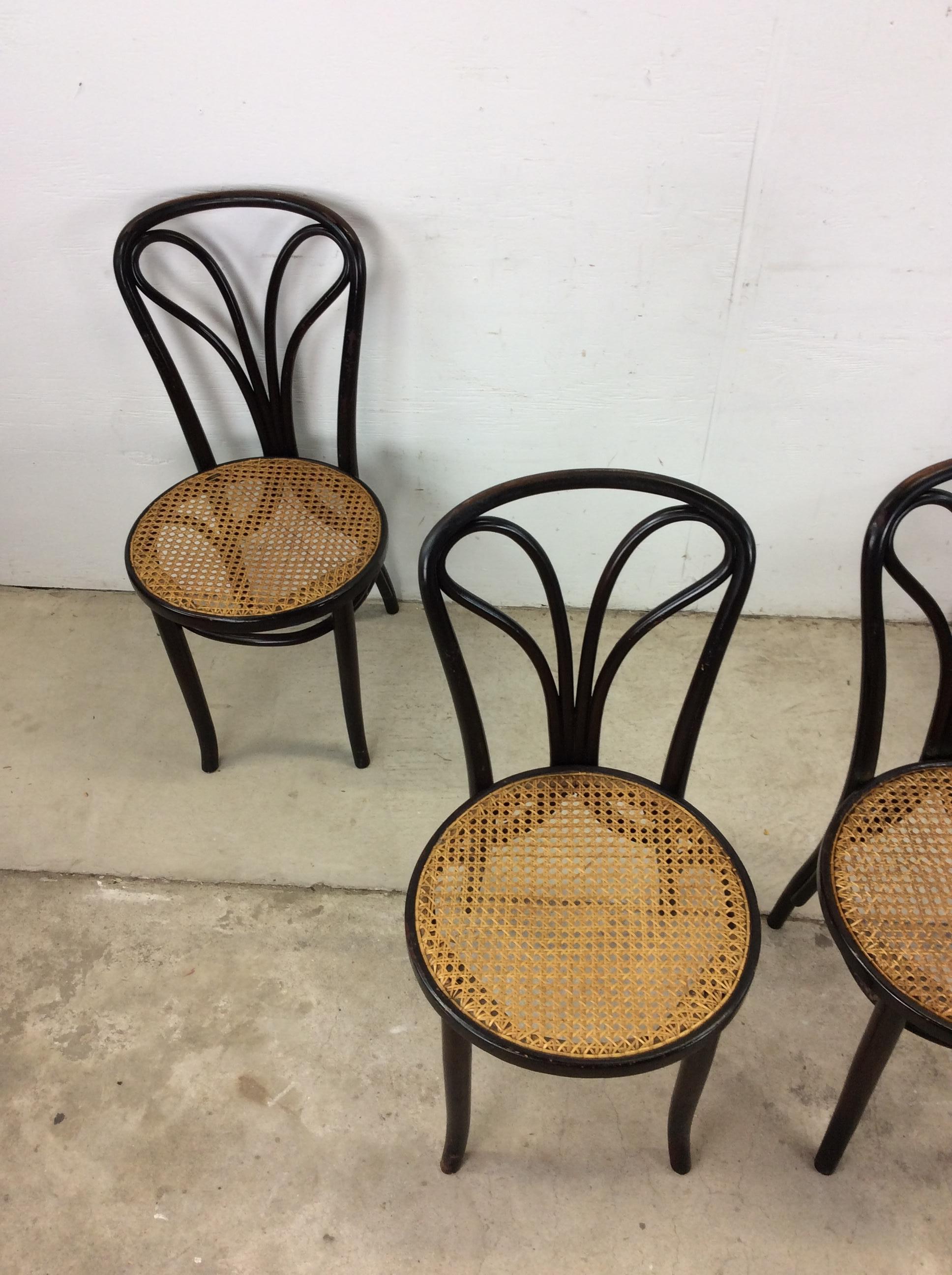 This set of four antique cafe chairs features bentwood construction, original finish, newer caned seats, and tall tapered legs.

Dimensions: 16.75w 20d 34.5h 17.5sh

Condition notes: Original finish is OK. These chairs are very sturdy. Seat backs