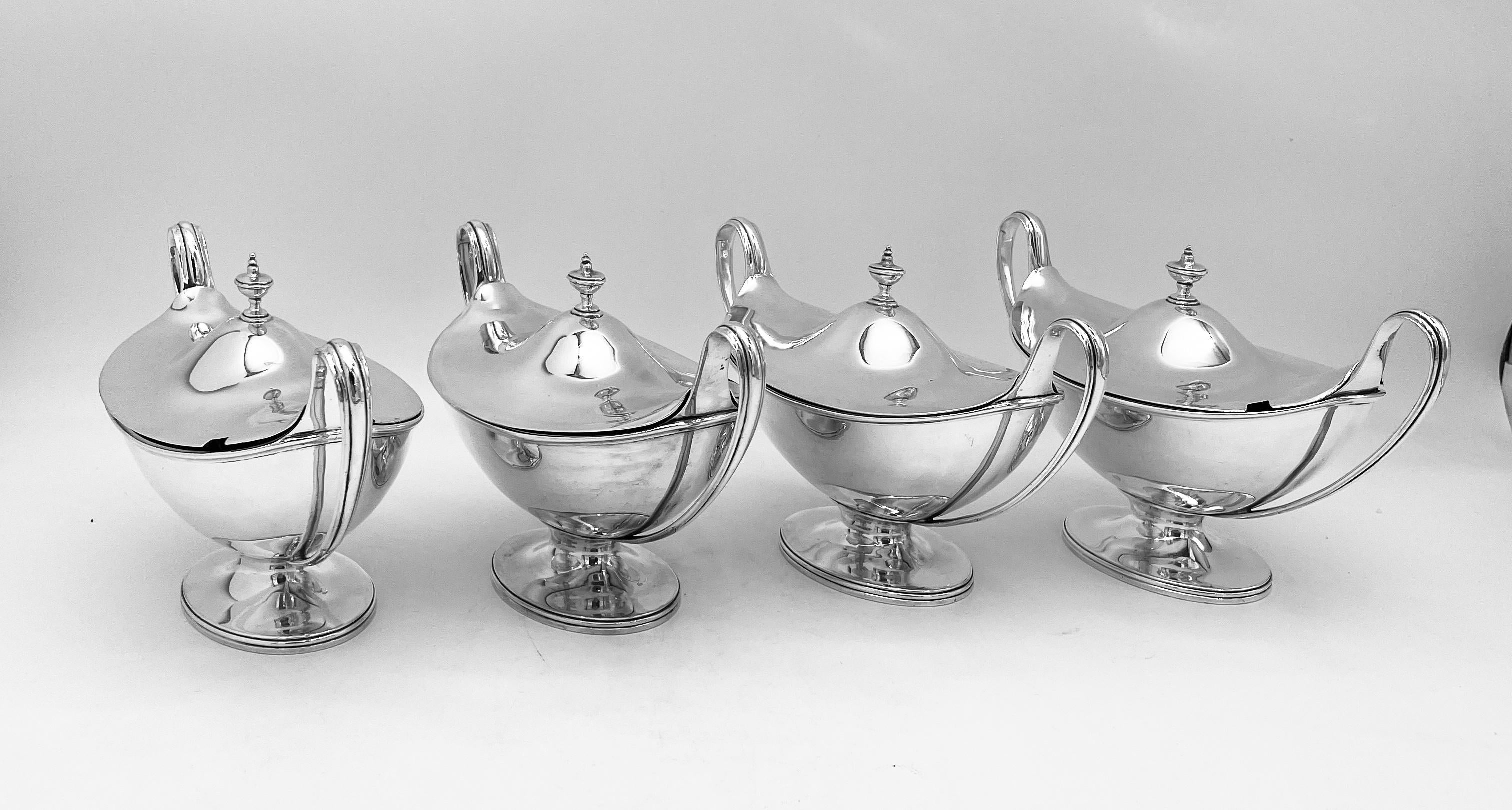 A charming and beautifully made set of 4 Antique Sterling Silver Sauce Tureens, made by the silversmith John Robins, and hallmarked in London 1789.
Each tureen has a detachable lid, and all eight separate pieces, 4 tureens and 4 covers, are original