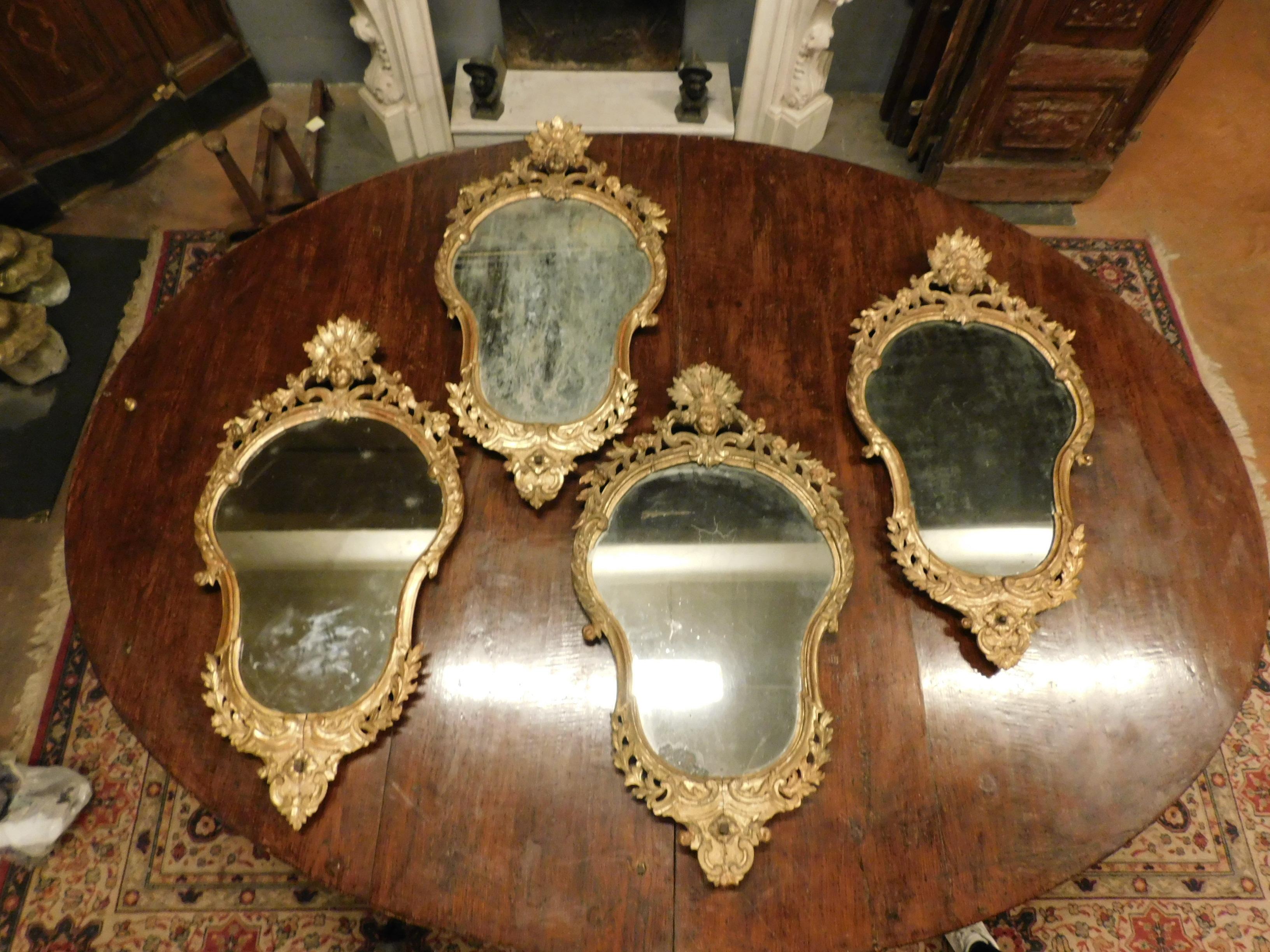Antique and beautiful Set of 4 fan-shaped mirrors with richly carved and gilded solid wood frame, built in the 18th century for an important noble castle in Italy.
Stunning and of great value, extraordinary recovery in this quantity and of this