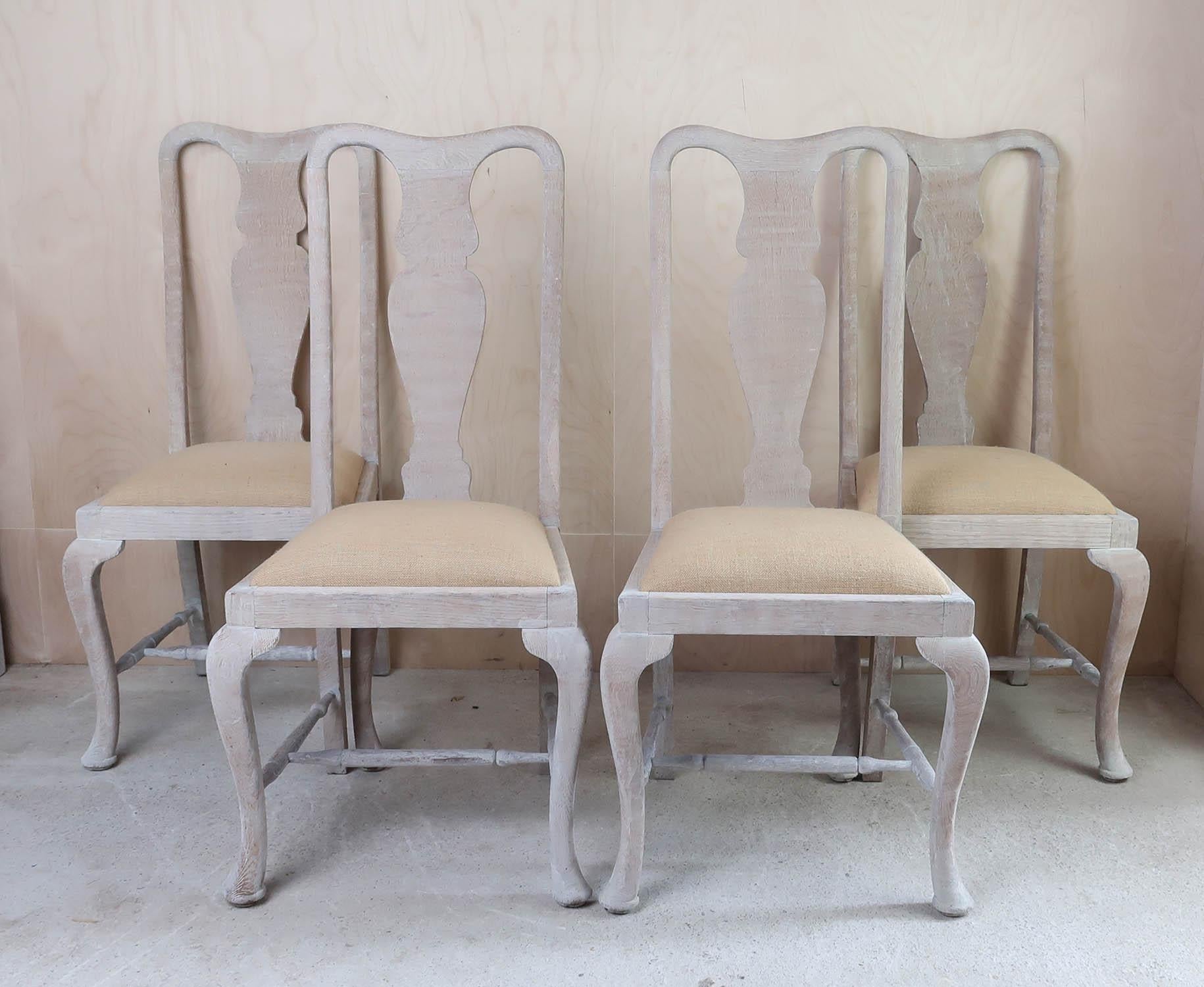 A delightful matching set of 4 English limed oak chairs. 

They have been recently limed to enhance the beautiful grain in the wood.

The seats have been re-upholstered in hessian or burlap.

The chairs are 1920s.

The chairs are sturdy. They have