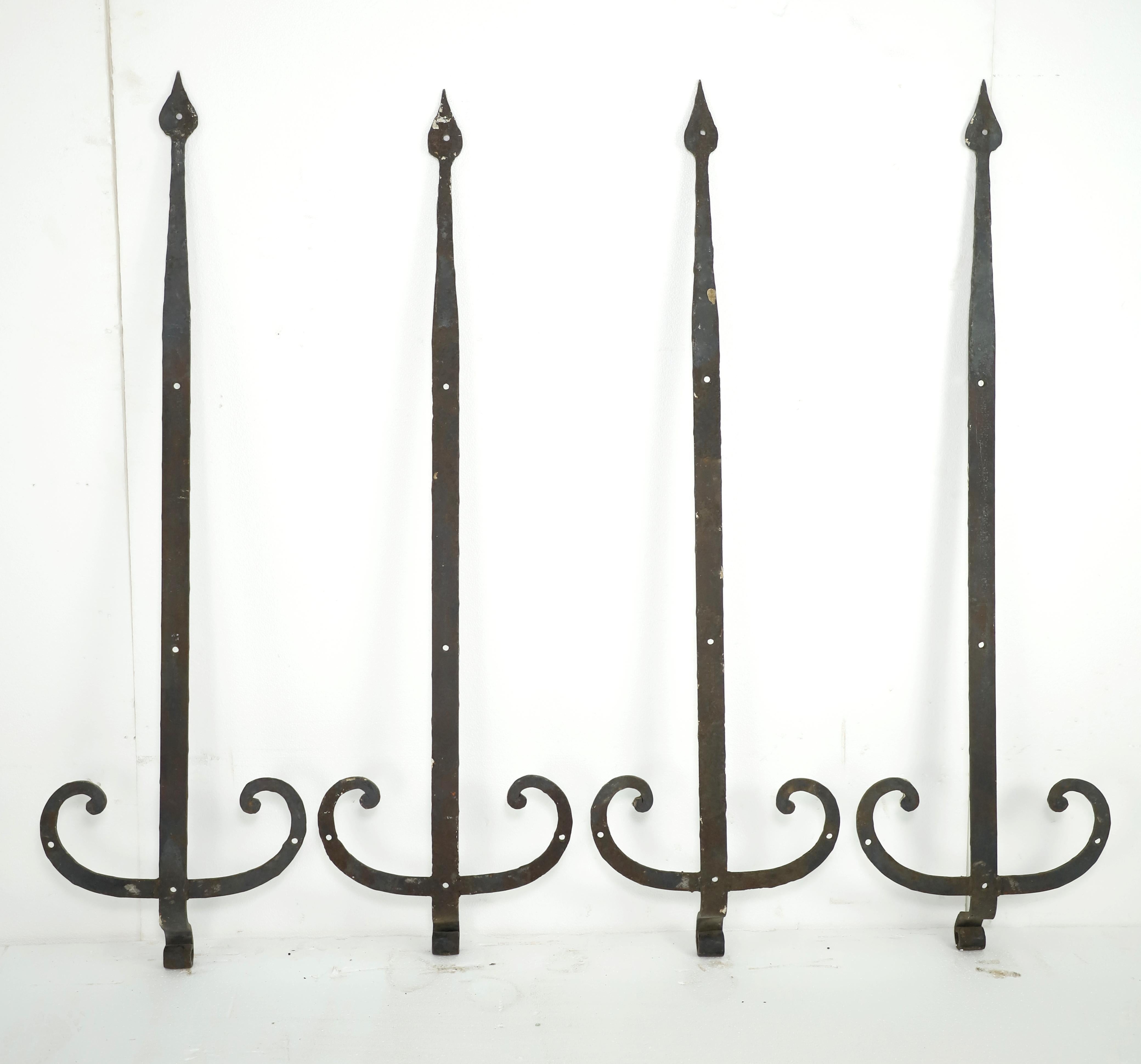 Black antique spear shaped strap hinges with curled details on the sides. All hand forged. They are in good condition. Priced as a set. Please note, this item is located in our Scranton, PA location.