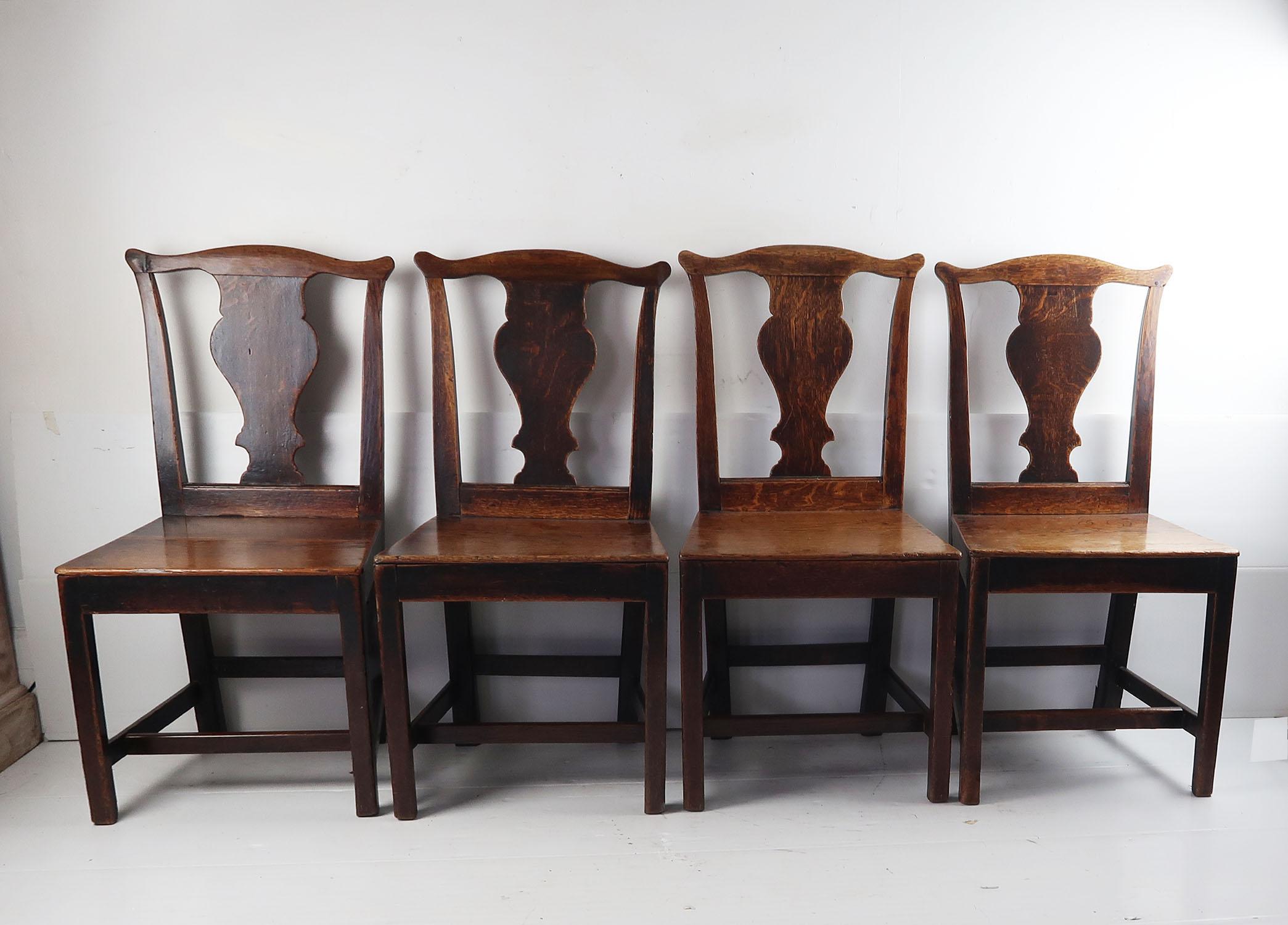 A great set of 4 naive oak country chairs.

Lovely color.

In the Country Chippendale style.

I particularly like shape of the splat.

The chairs are English, circa 1780.

They are sturdy in good sound condition and have all been assessed