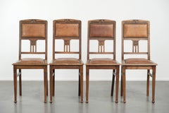 Set of 4 antique oak dining chairs in Art Nouveau style with sheepskin