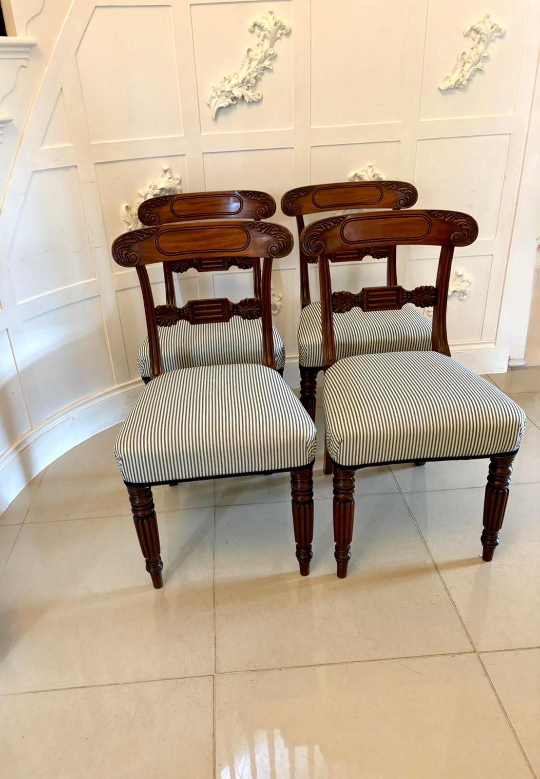 Set of 4 antique Regency quality carved mahogany dining chairs having a quality carved and reeded top with a carved mahogany splat to the centre, newly reupholstered seats in a quality fabric standing on turned reeded tapering legs to the front and