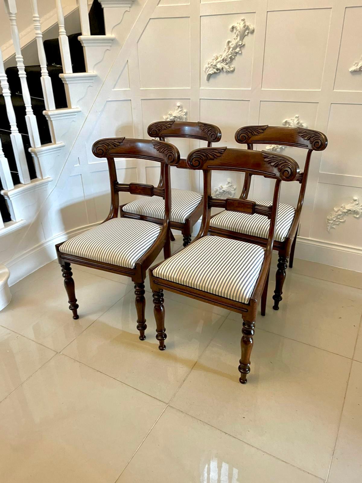 Set of 4 antique regency quality mahogany dining chairs having a quality carved mahogany top rail, carved mahogany splat to the centre with a figured mahogany panel, newly reupholstered drop in seats in a quality fabric standing on shaped turned