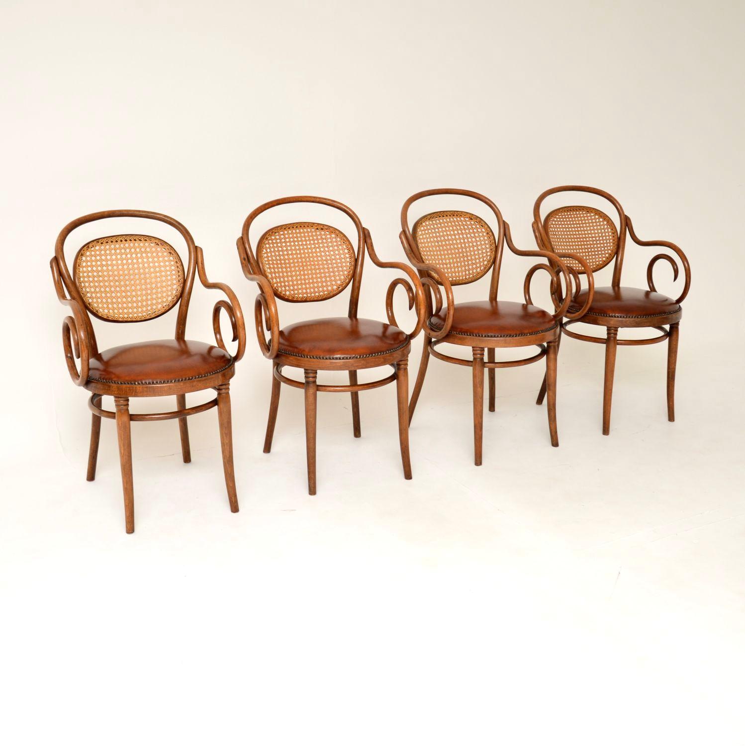 A beautiful set of four antique bentwood cafe dining chairs. These were made in Poland in the 1950-60’s, in the original Thonet factory using the original Thonet machinery.

They have a gorgeous design, with curvaceous bentwood frames, cane rattan