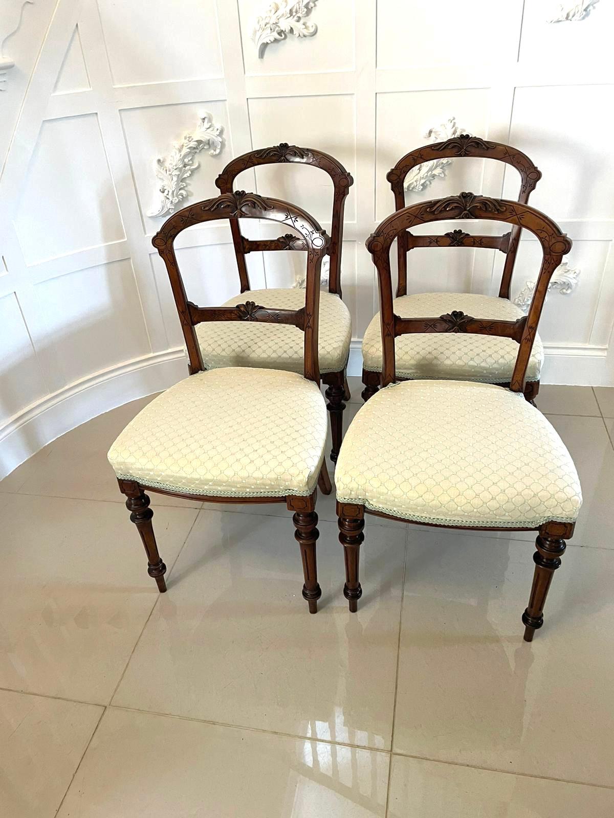 Set of 4 antique Victorian quality carved walnut dining chairs having quality carved solid walnut shaped backs, newly reupholstered seats in a quality fabric standing on turned reeded legs to the front and out swept back legs 

Measures: H 89 x W