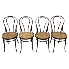 Lot de 4 chaises de salle à manger vintage en bois cintré de type café canne par Thonet 