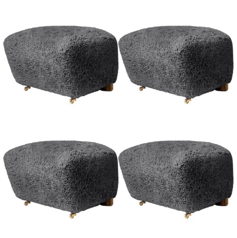 Set of 4 antrachite natural oak sheepskin the tired man footstools by Lassen.
Dimensions: W 55 x D 53 x H 36 cm 
Materials: Sheepskin

Flemming Lassen designed the overstuffed easy chair, the tired man, for The Copenhagen Cabinetmakers’ Guild