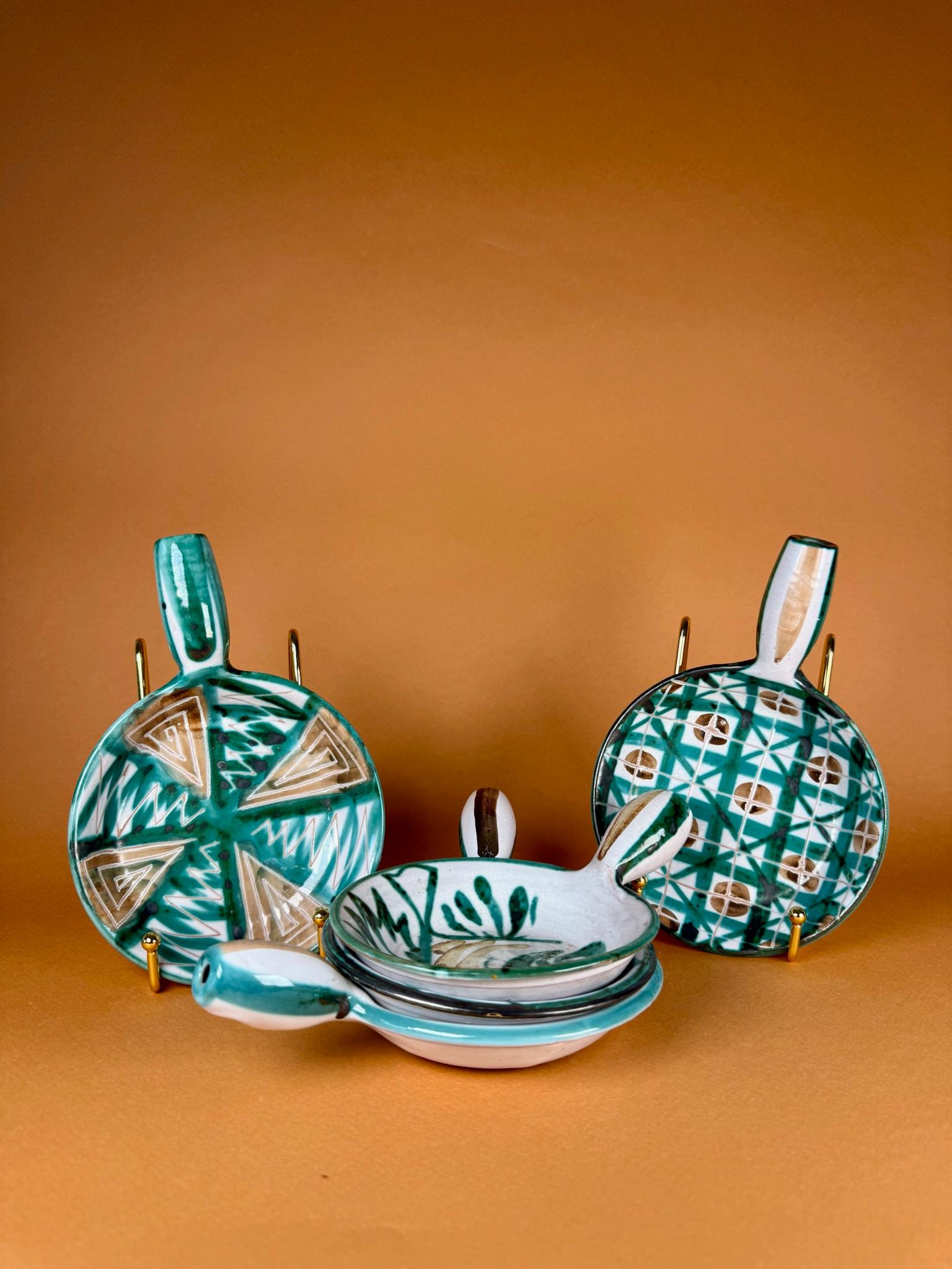 Origin
Vallauris, France, circa 1950s

Materials
Glazed ceramic

Condition
Very good vintage condition, consistent with age and light use

A delightful set of four handled appetizer dishes by Robert Picault, one of the most influential ceramists of