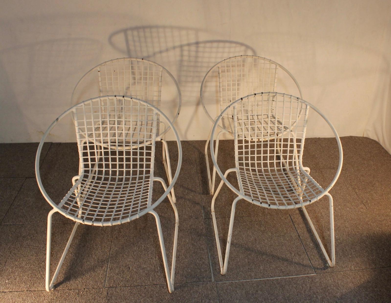 A set of four original white painted iron armchairs.
They can be placed inside or outside.
Armchairs as is