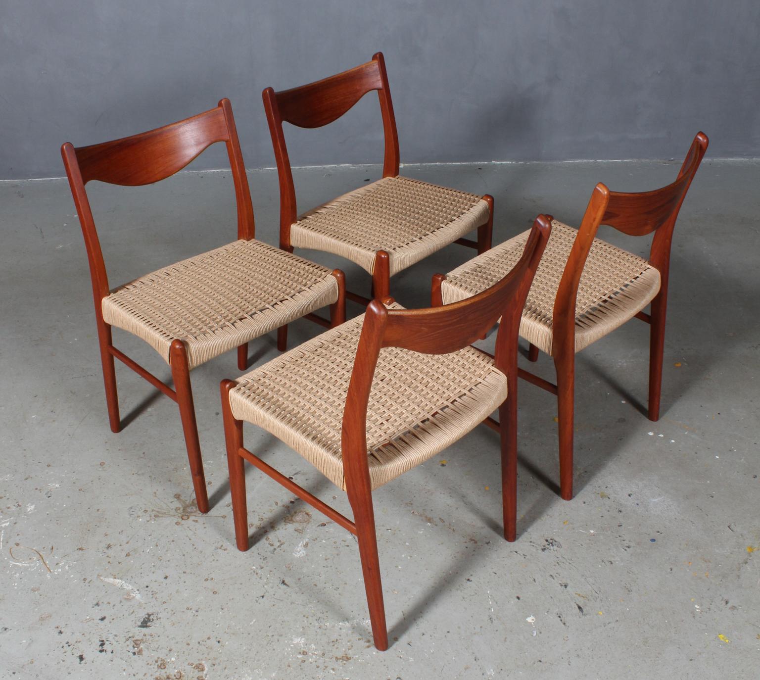Four dining chairs designed by Arne Wahl, model GS61 for Glyngore Stolefabrik. 

Chairs crafted of partly solid teak with new weaved paper cord seats.
