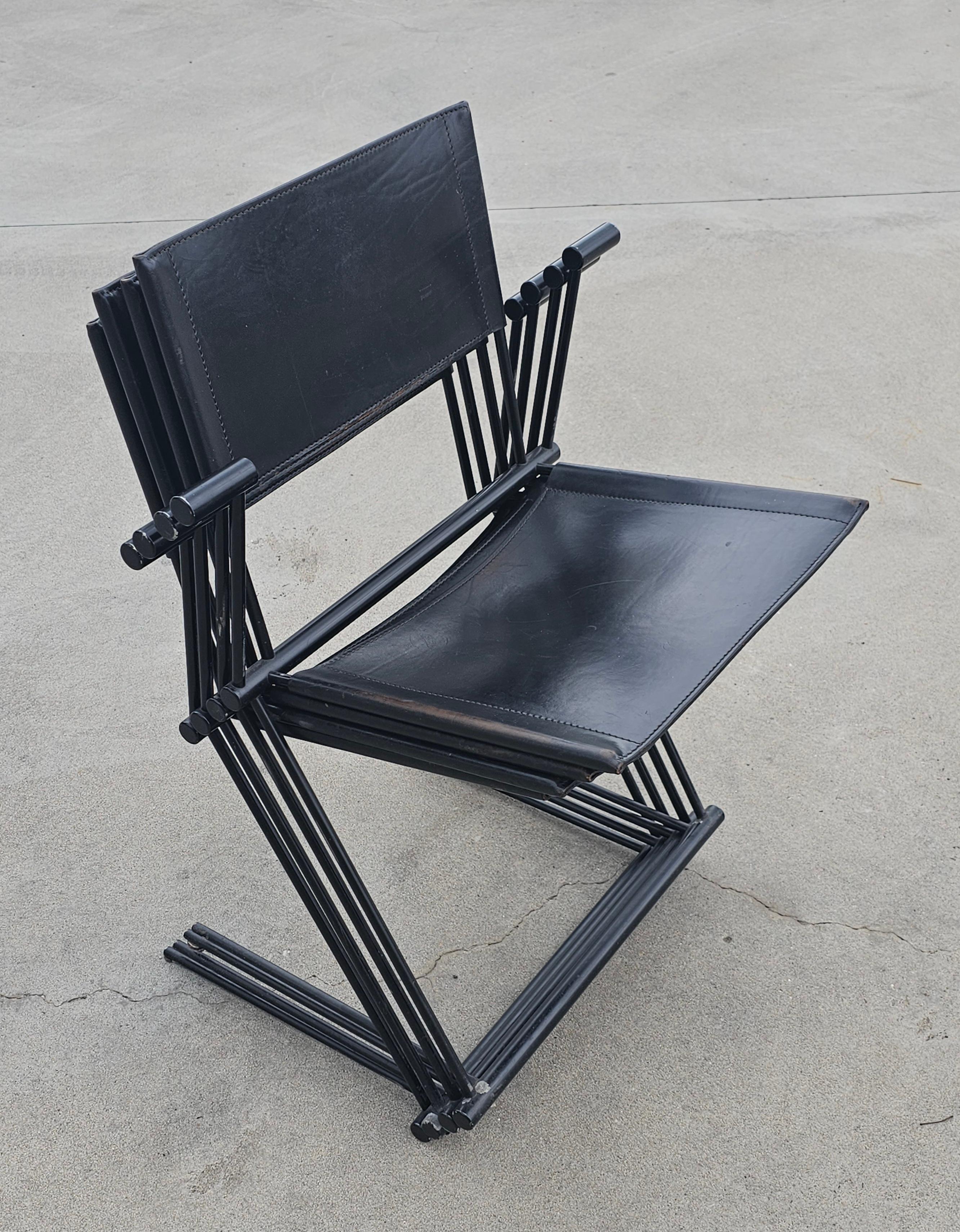 In this listing you will find a set of 4 Ballerina Dining Chairs designed by Herbert Ohl for Matteo Grassi. All chairs have manufacturer's stamp on the backrests. The cantilever chairs are made of black lacquered spring steel, white the seats and