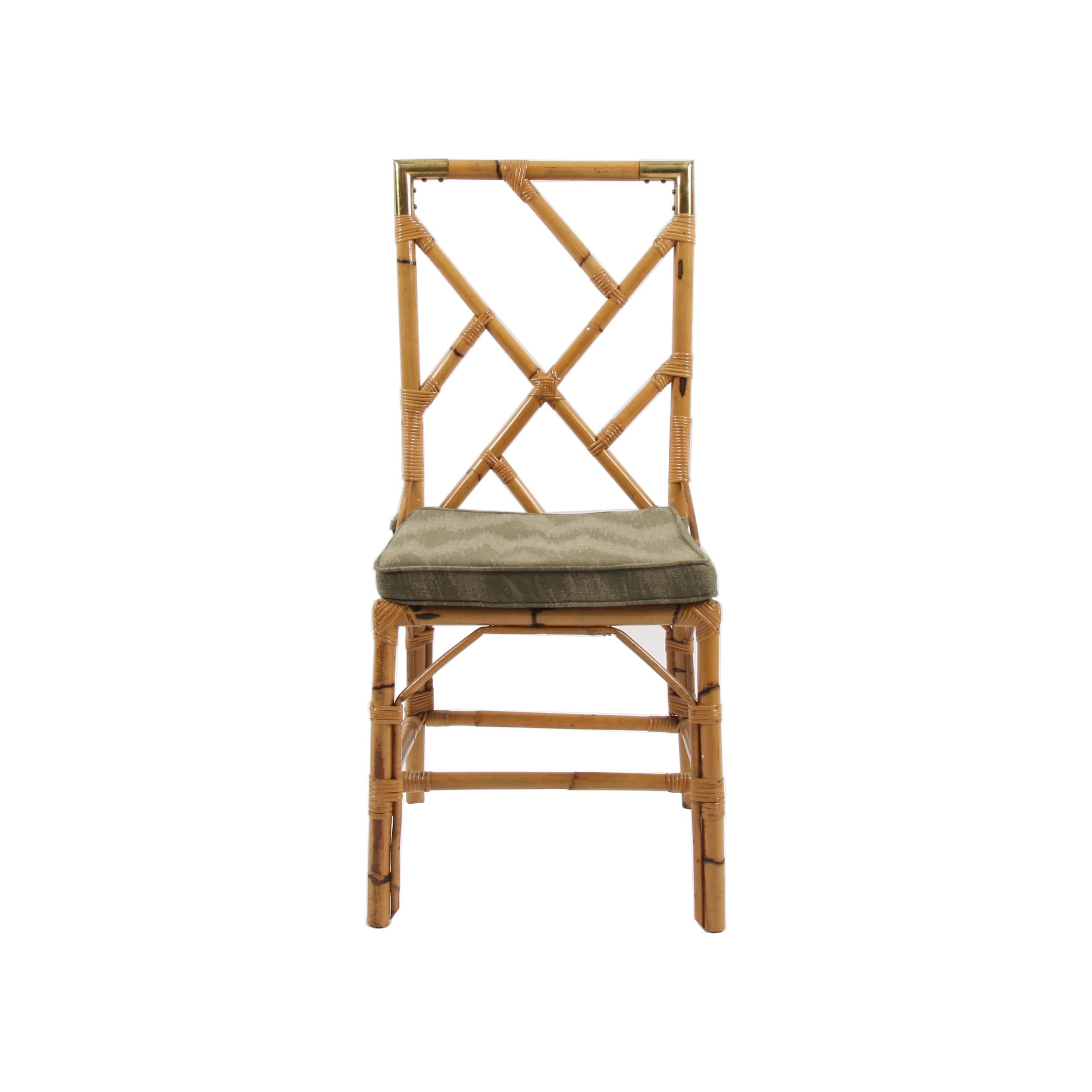 This set of 4 bamboo dining chairs have beautiful green cushions and lovely brass detail.

Made in France in the 1960s for the Galerie Portuondo in Paris. 

Dimensions: Full height 96cm, seat height 43cm and seat depth 40cm.

Price shown is